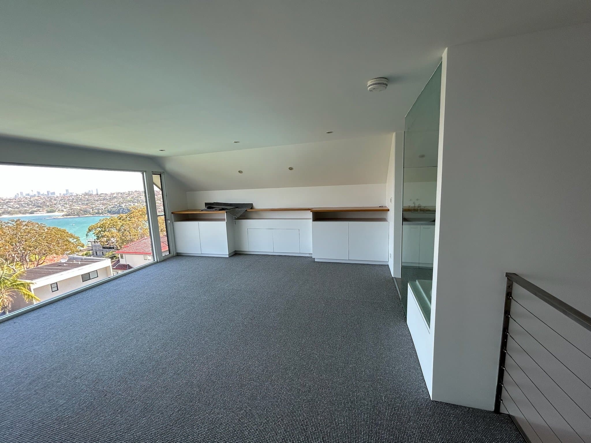 Upper room in Balgowlah Heights home after interior painting with harbour view