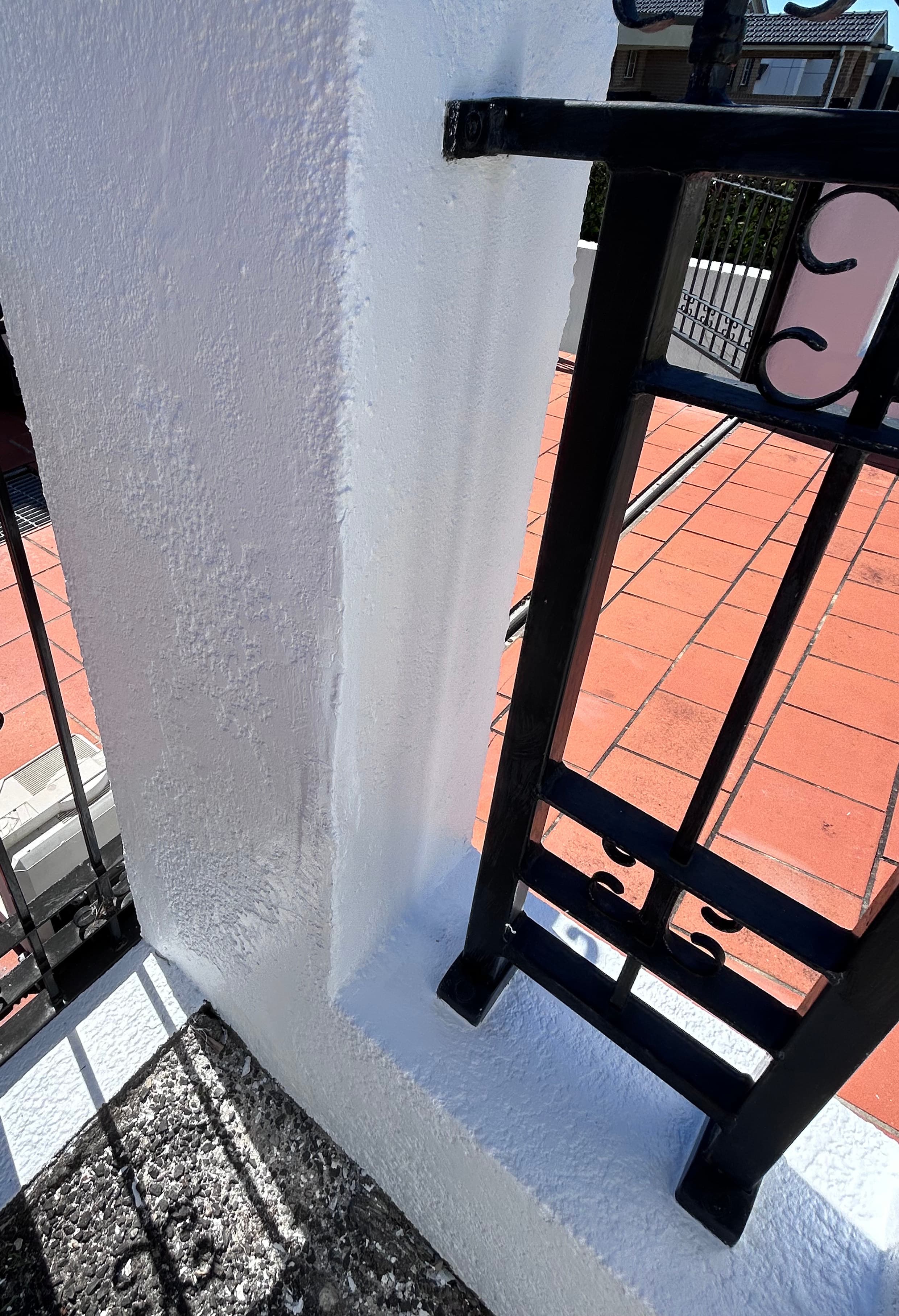 The same Blakehurst front fence gate pillar after exterior repainting