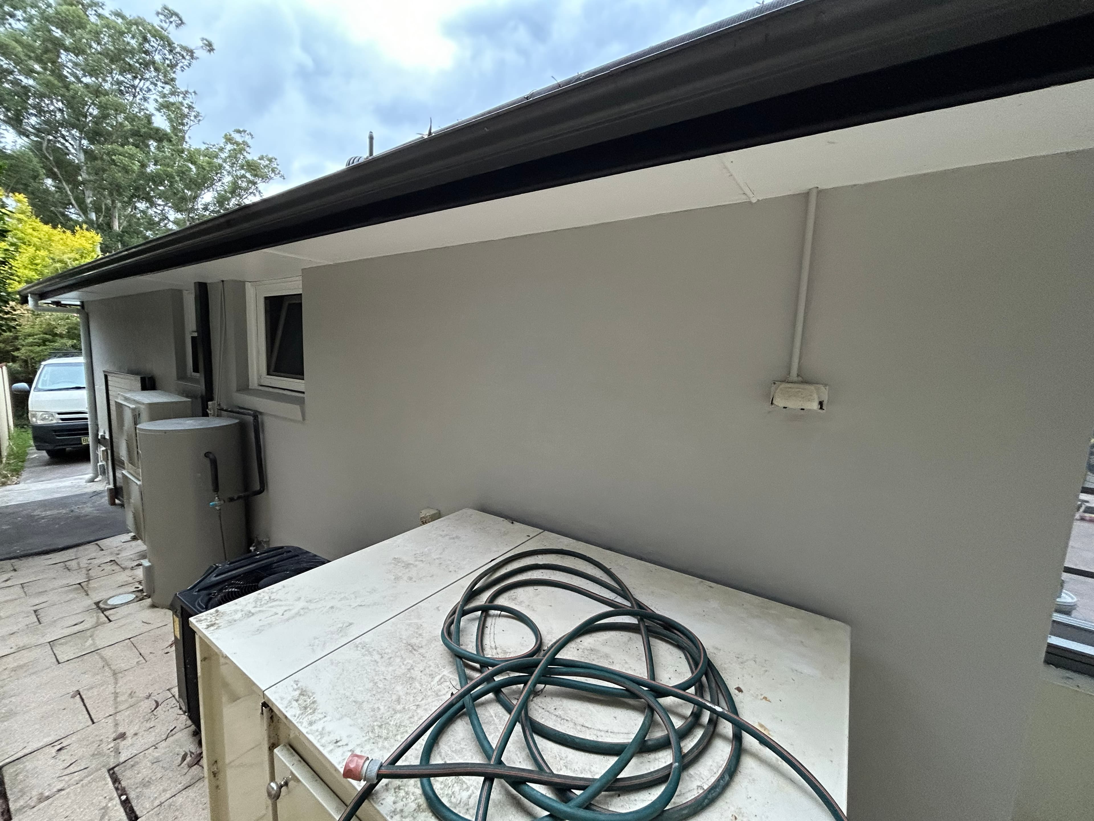 Carlingford side wall after exterior repainting beside utility area