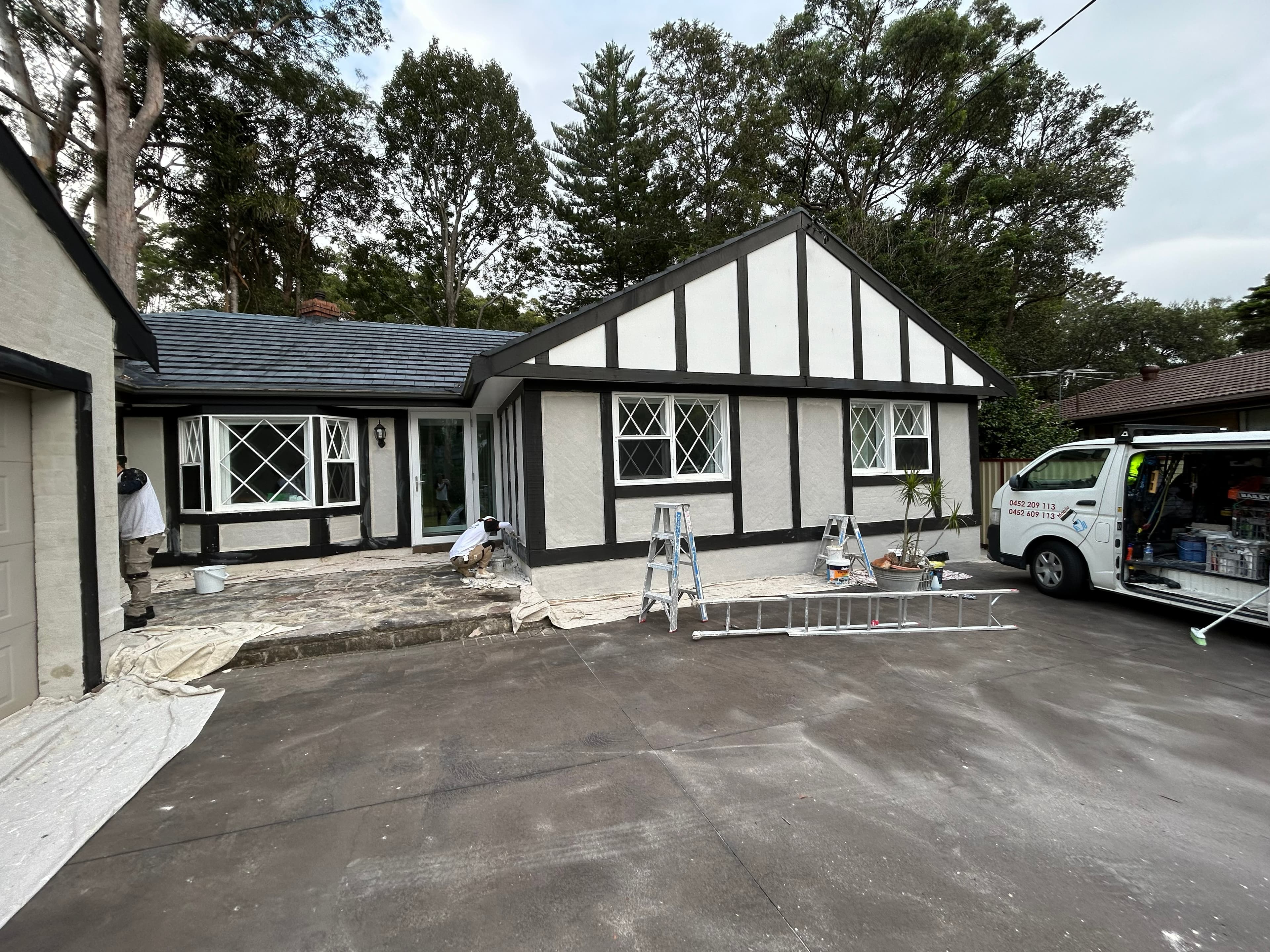 Carlingford exterior repainting in progress with painters preparing front facade