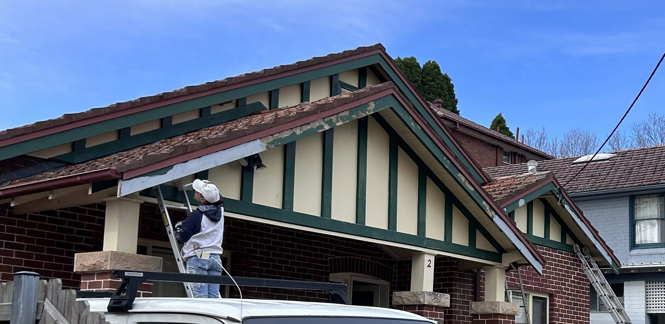 Chatswood exterior gable and trim before repainting with peeling paint and preparation work