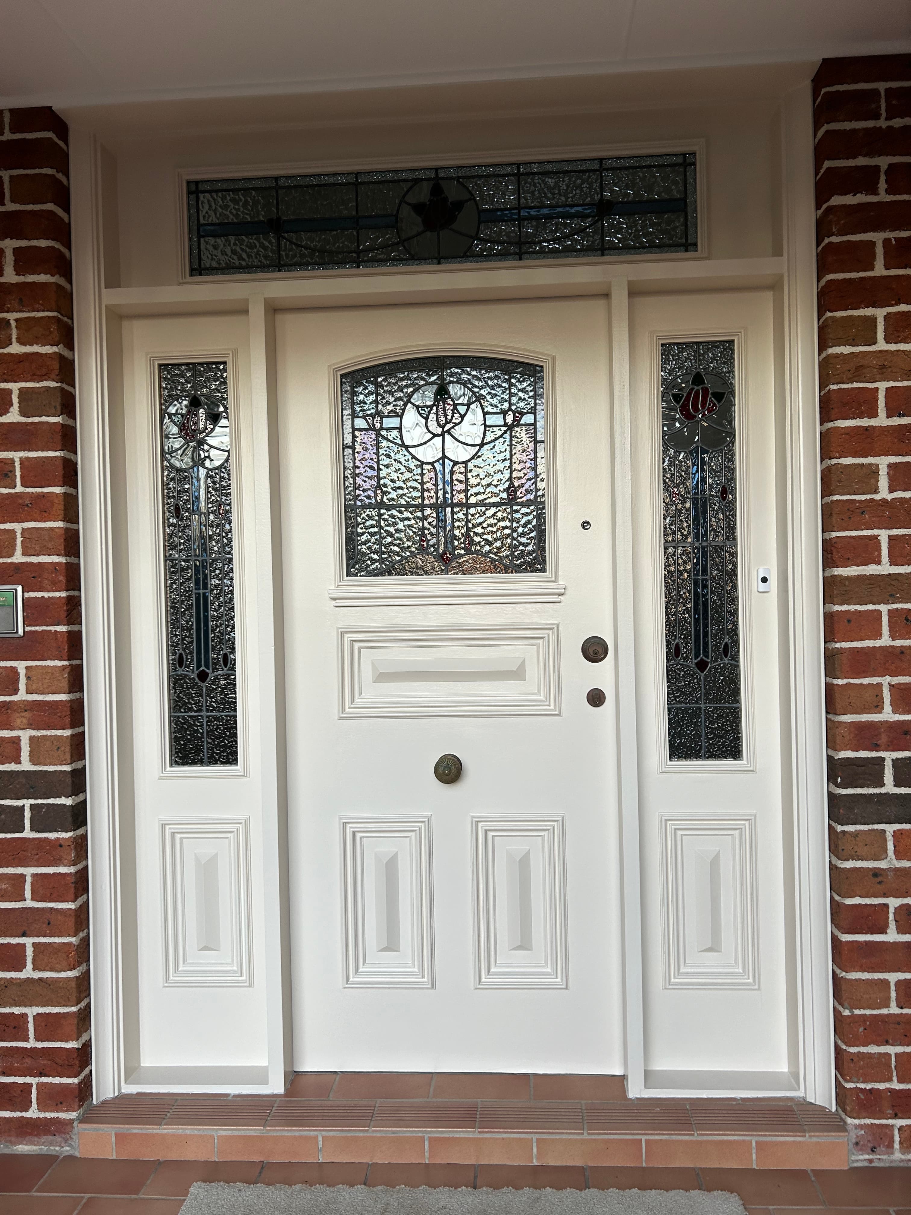 Chatswood front entry door and stained glass surround after exterior painting