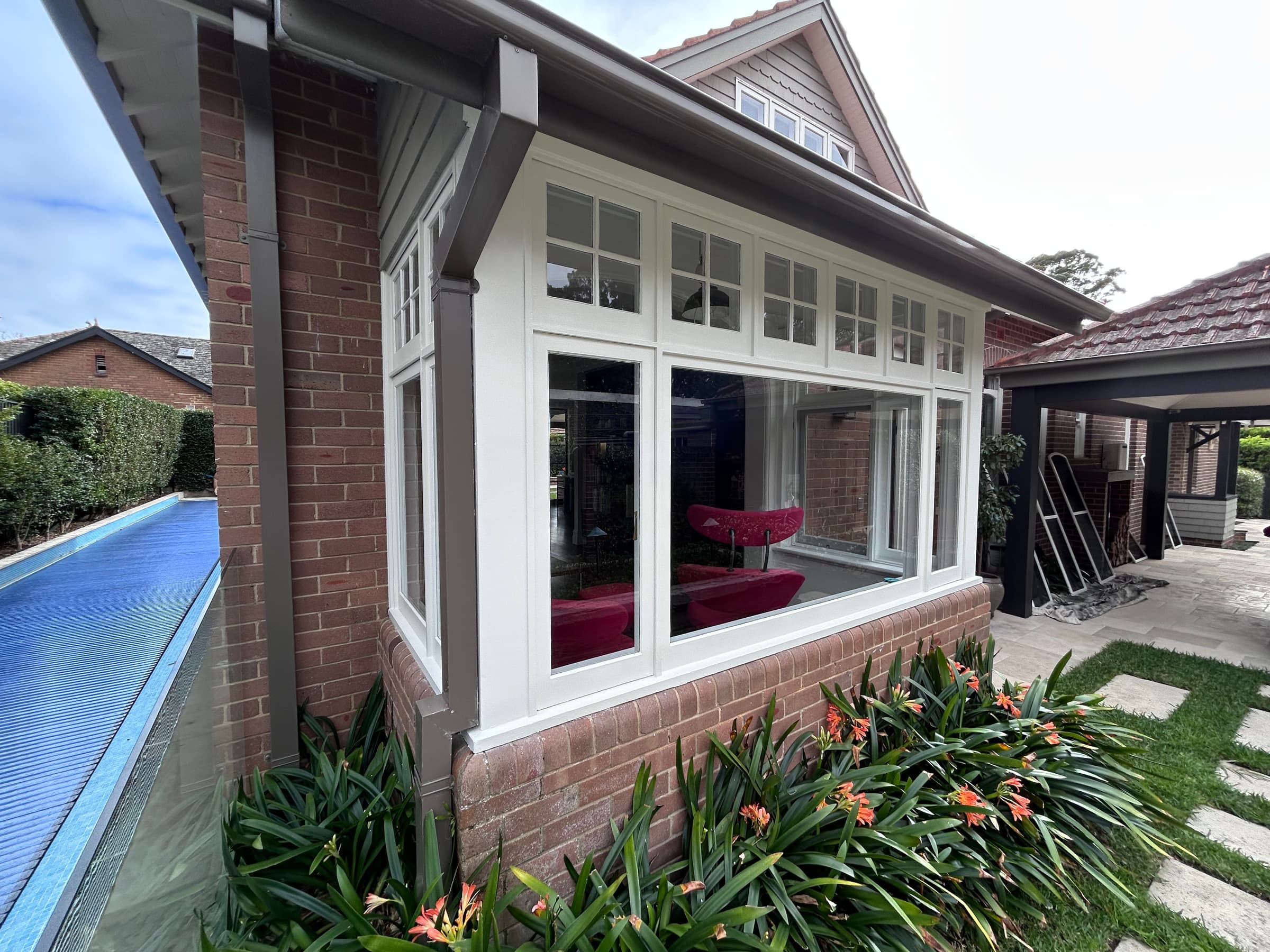 Completed white timber windows after repair preparation and exterior painting in Chatswood