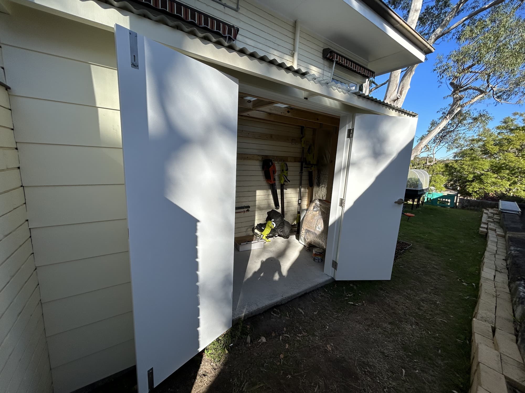 Completed garden shed front and doors after exterior painting in Chatswood West