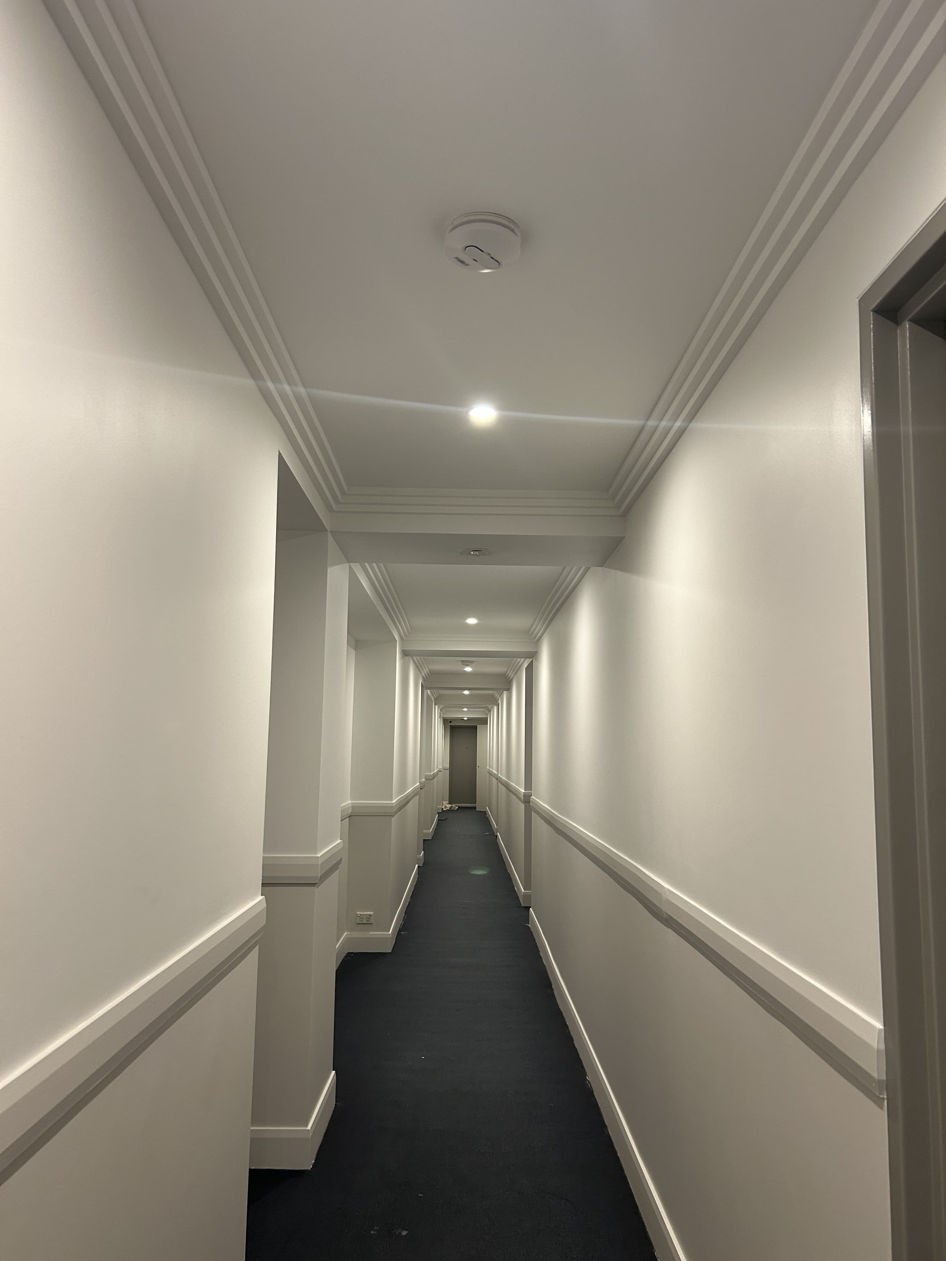 Dee Why strata hallway after fresh wall, ceiling, and trim repainting
