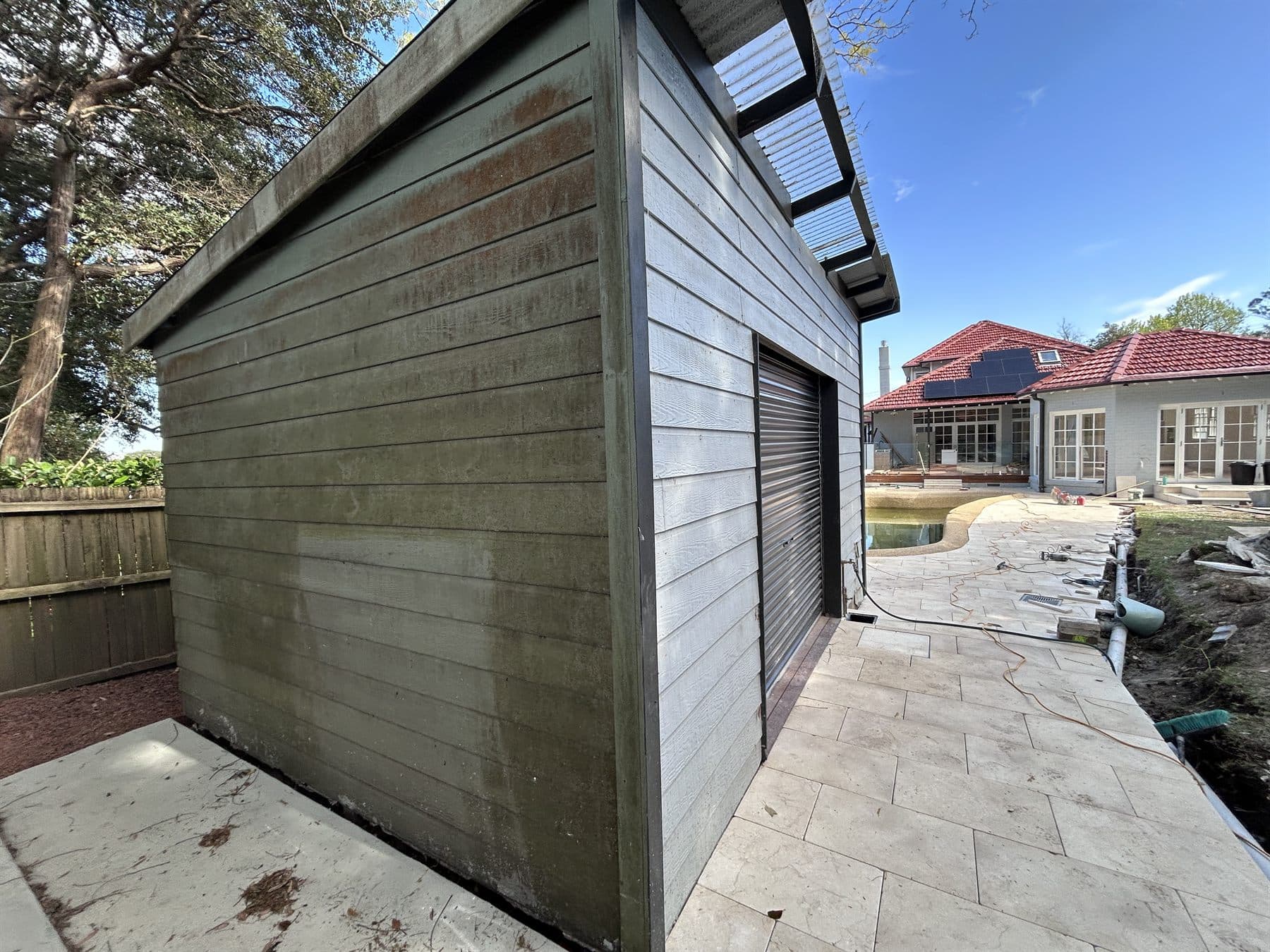 East Lindfield exterior outbuilding before repainting with weathered cladding and trim