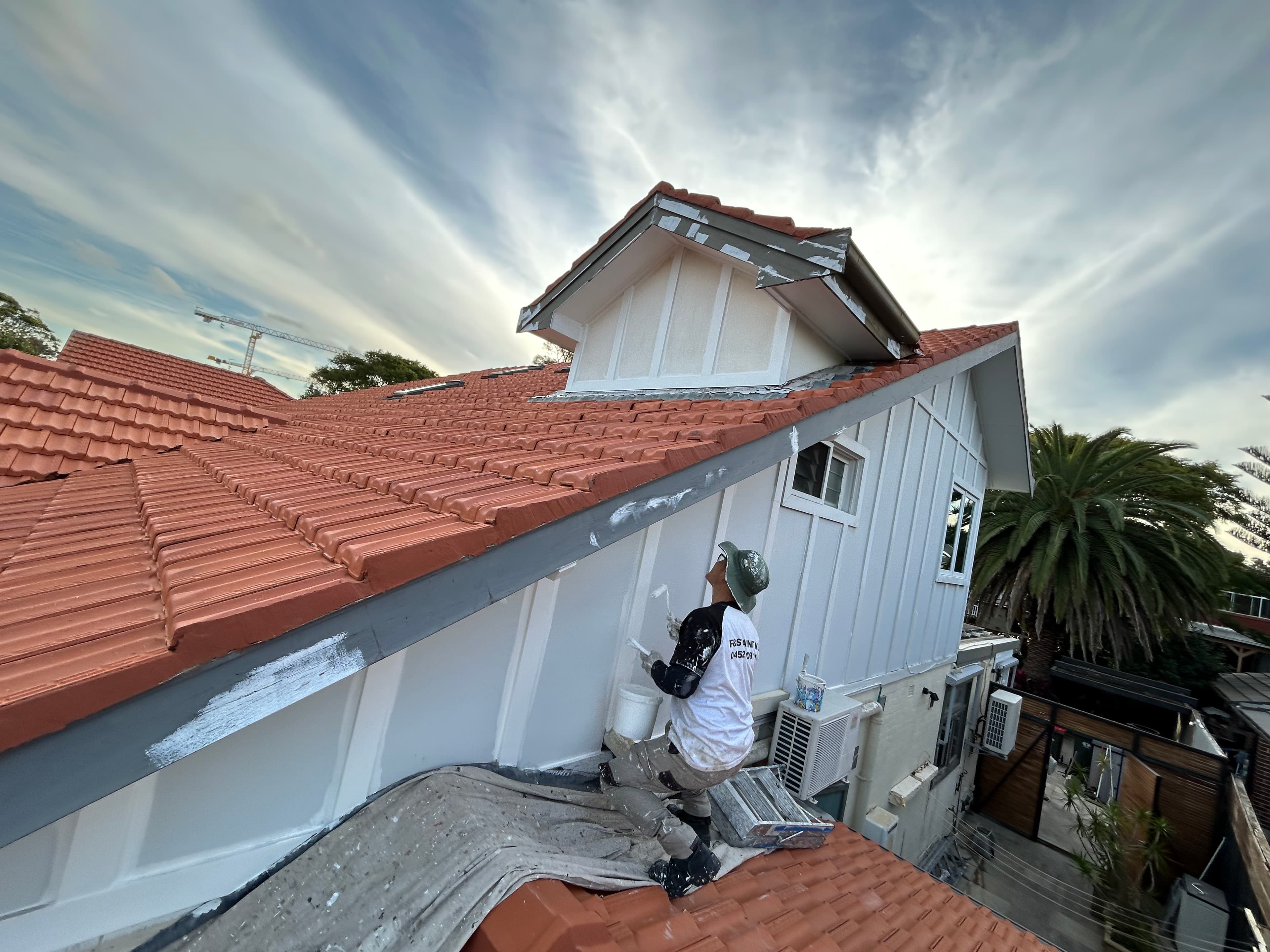 Exterior gable and roofline preparation before repainting