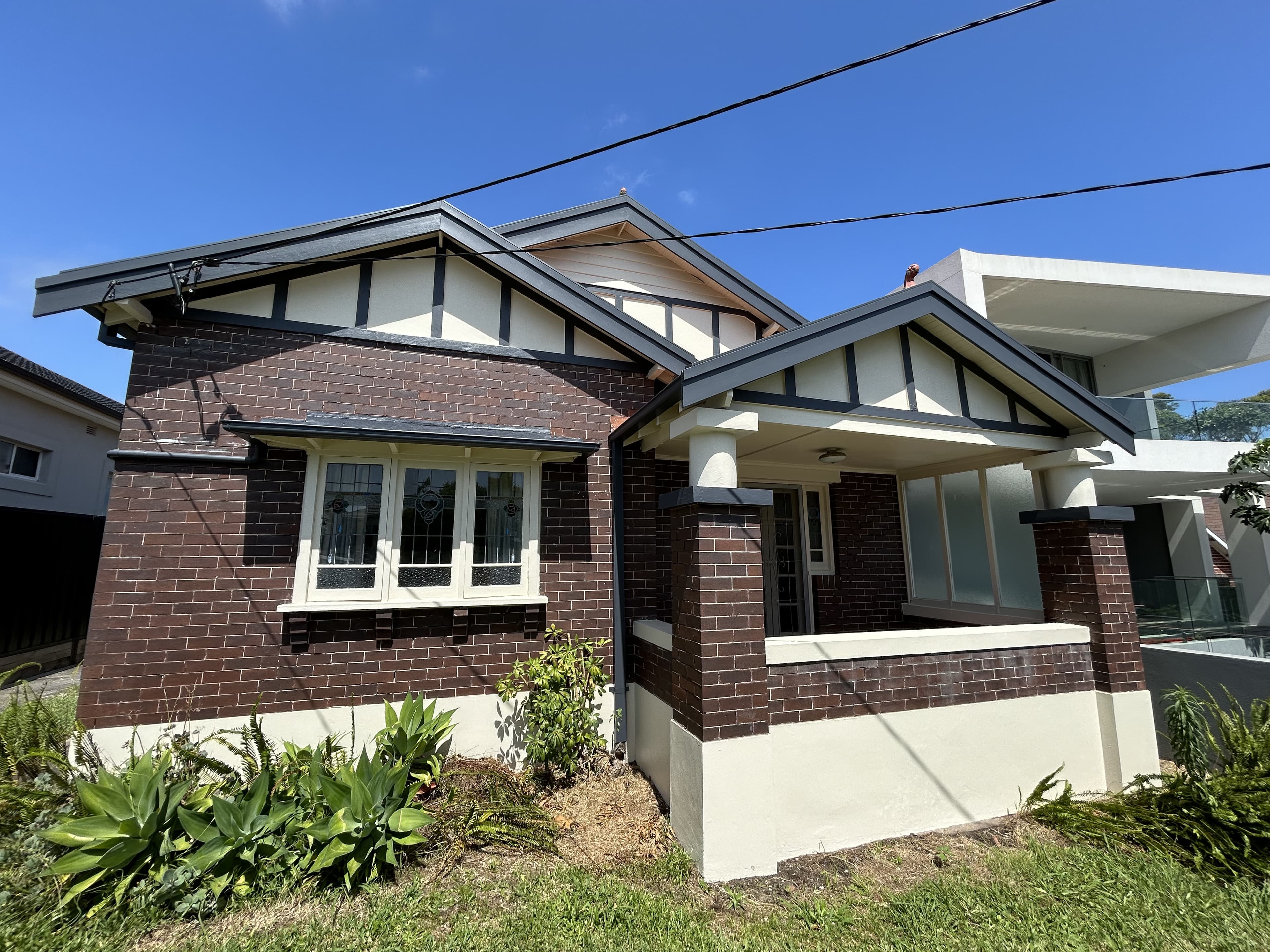 Front of a Sydney house exterior after repainting with fresh trim and facade finishes