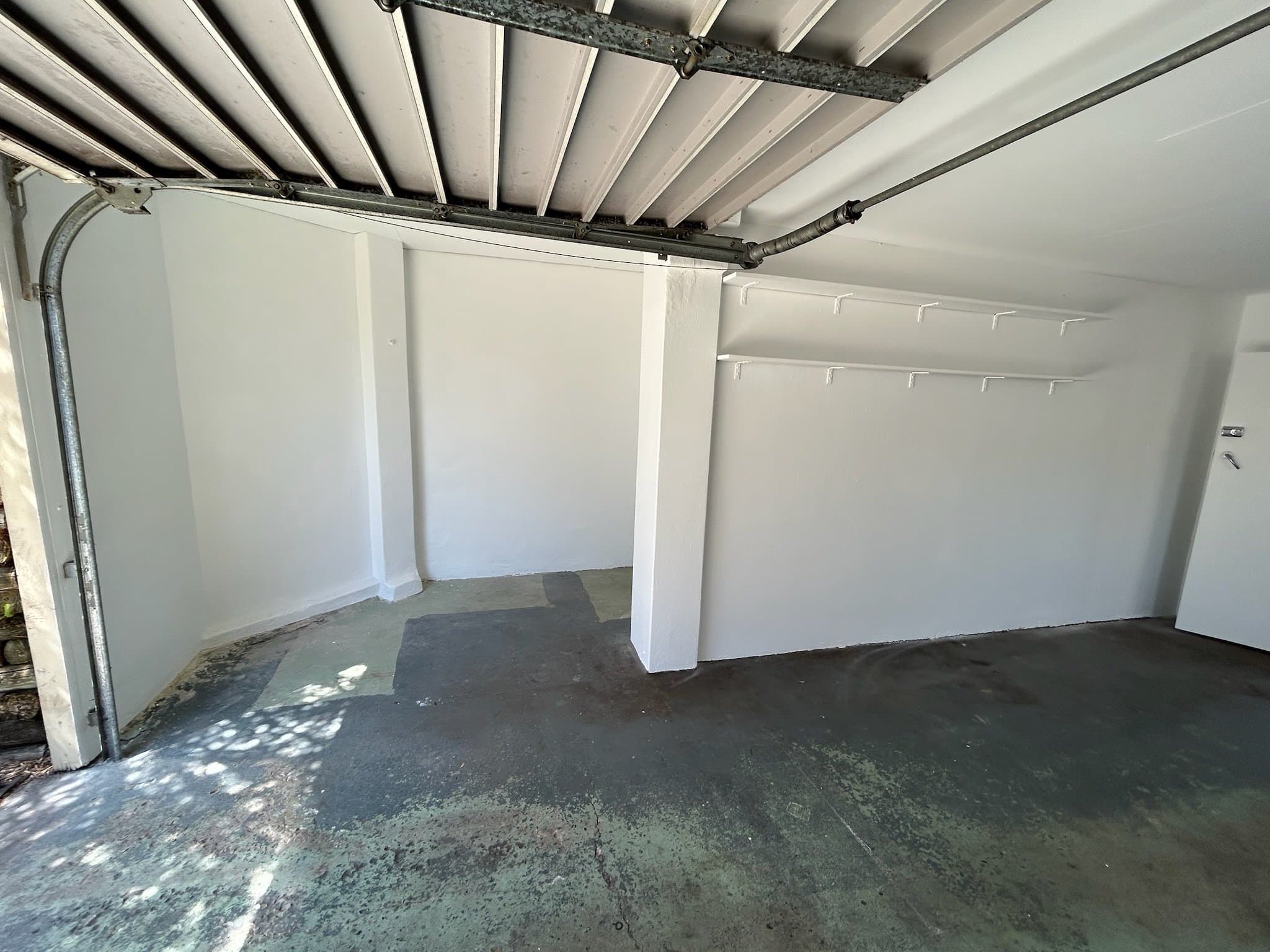 Freshly repainted garage interior walls after preparation in Sydney