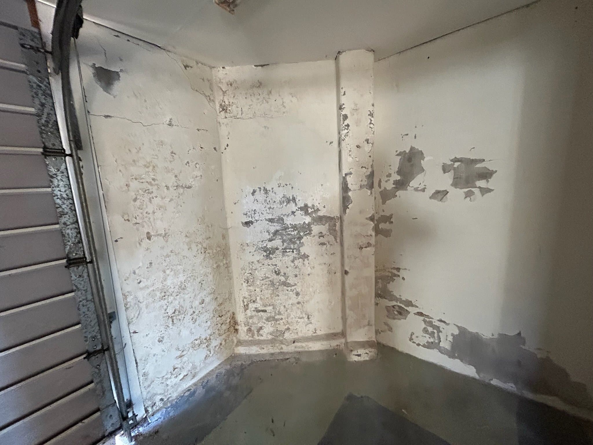 Garage interior walls before preparation and repainting in Sydney