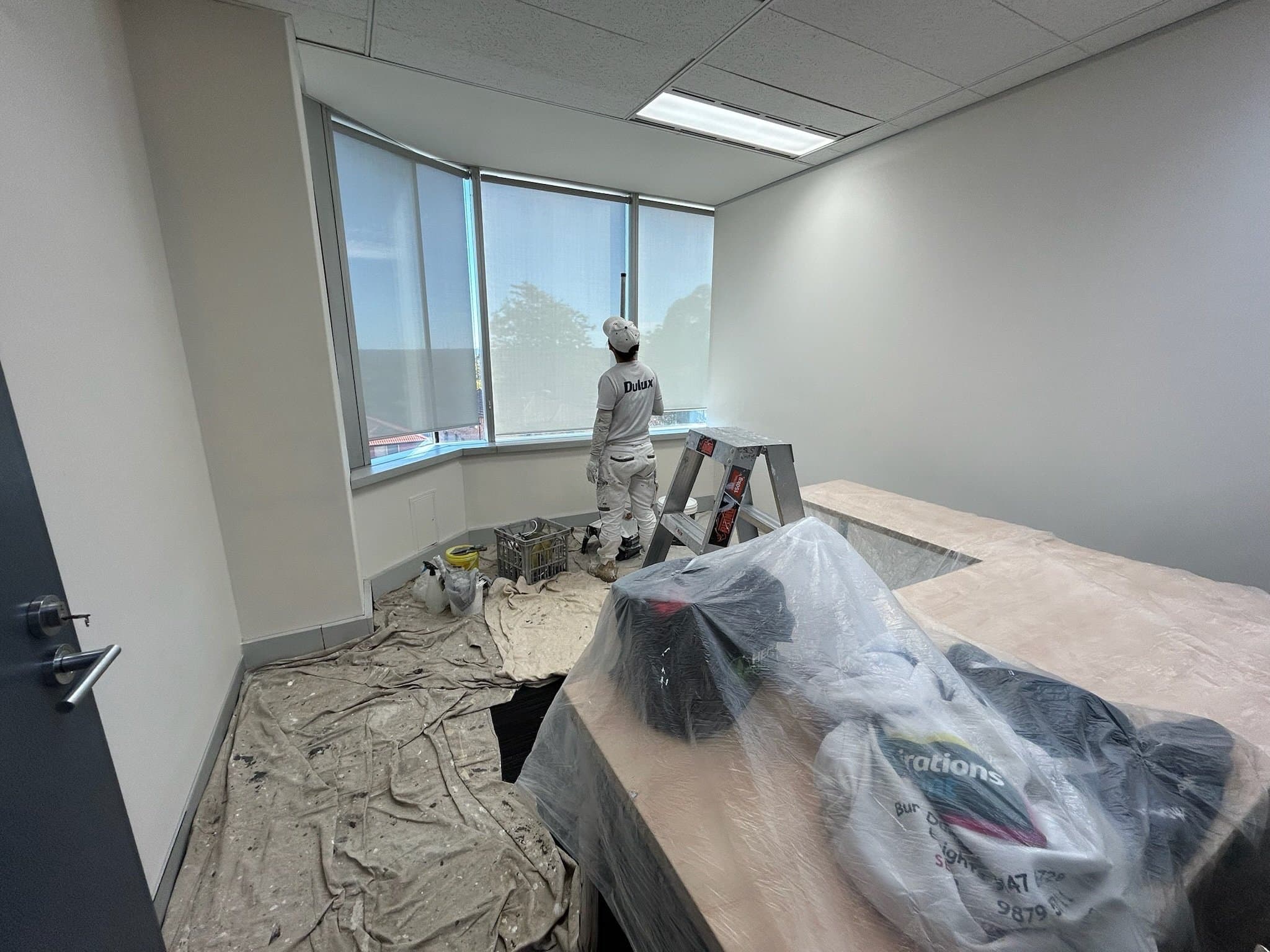 Office room protected and prepared before interior painting
