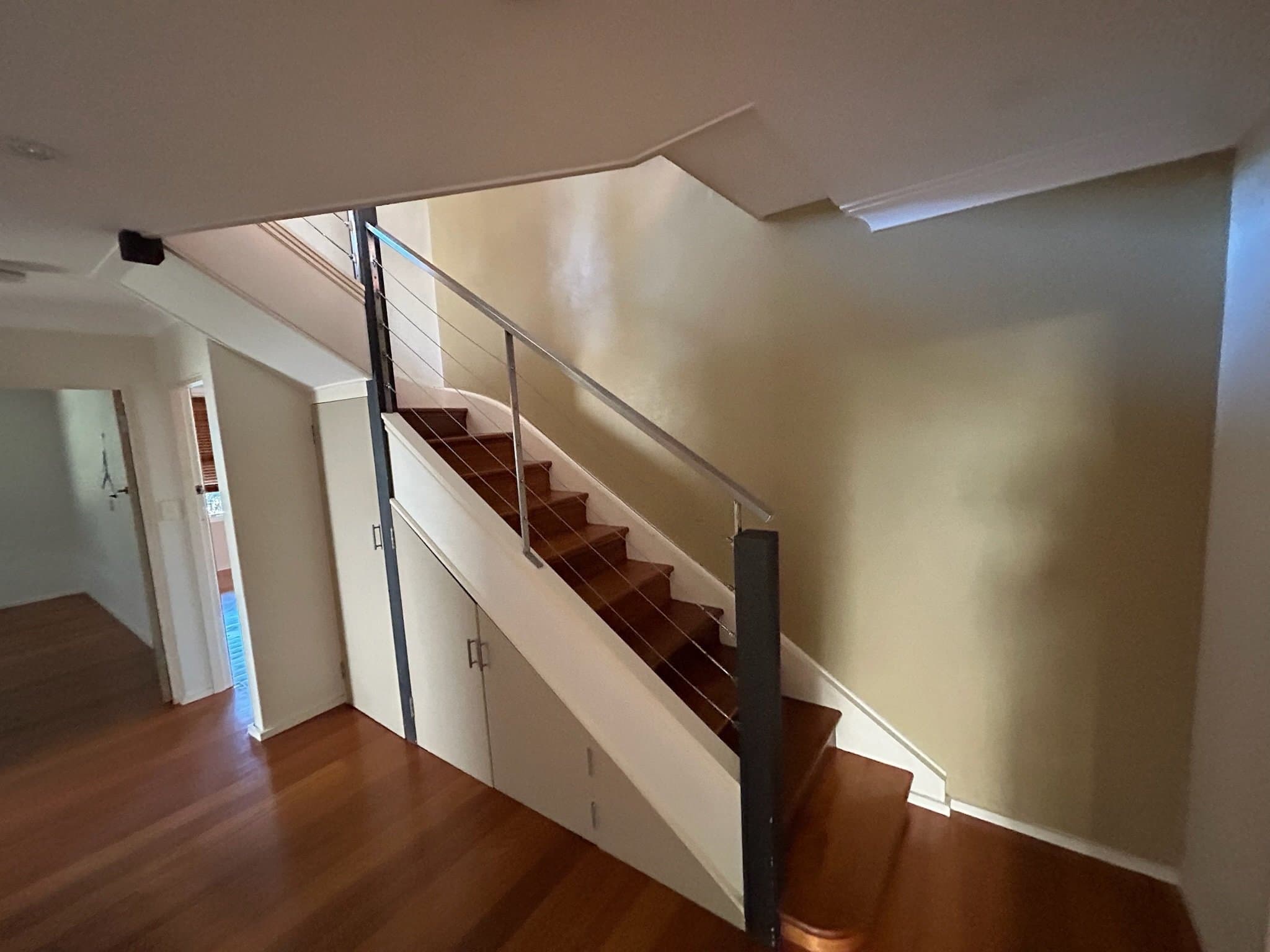 Interior stairwell walls before repainting in a Sydney home
