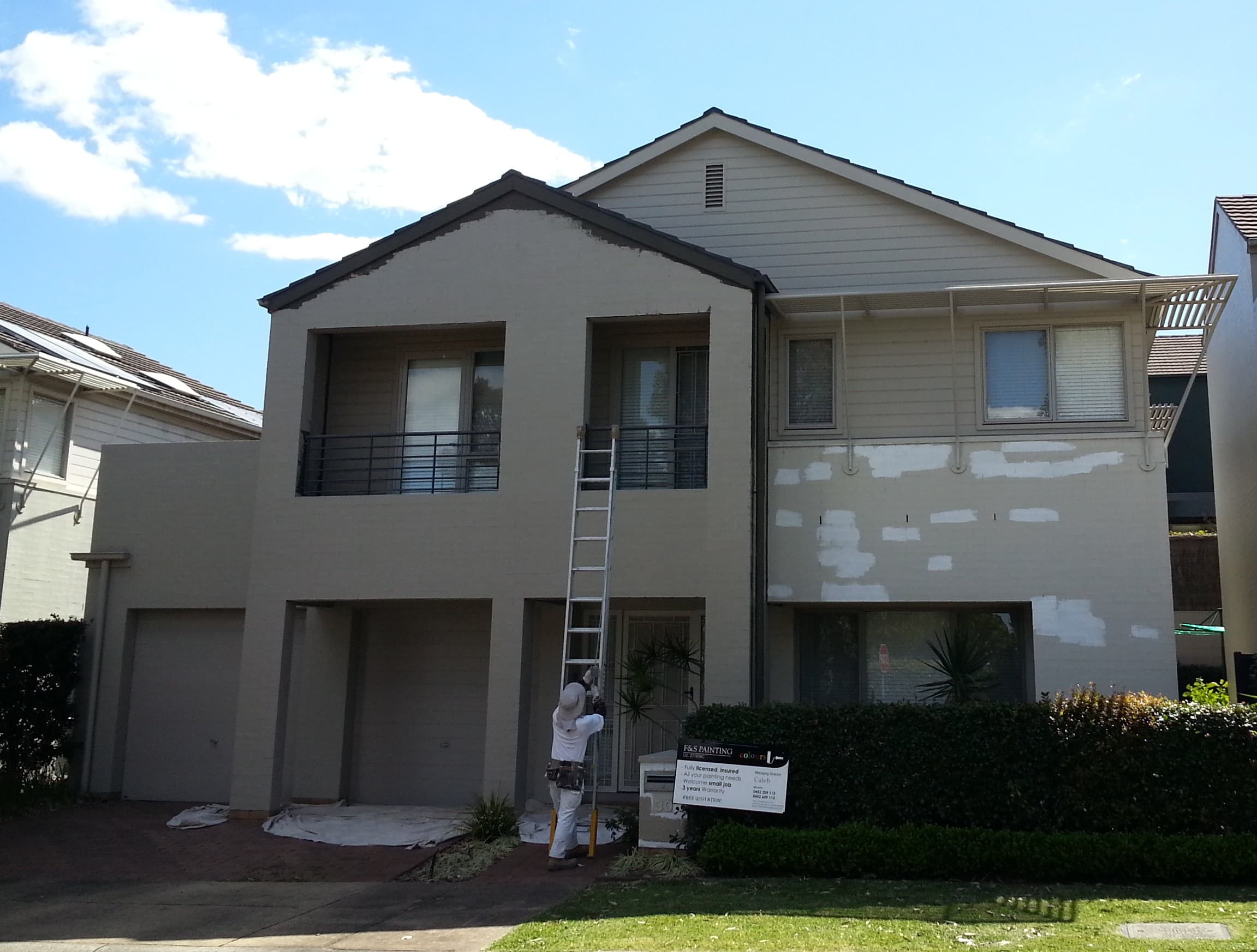 Newington house exterior before repainting with preparation patches on the front facade