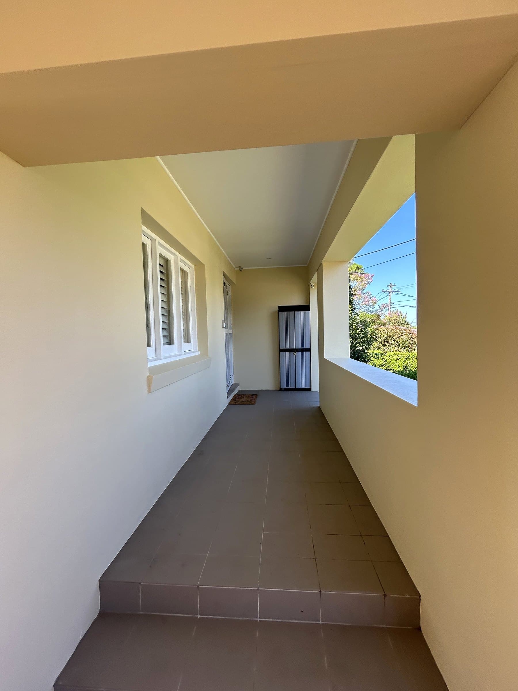 North Willoughby covered side walkway after exterior painting