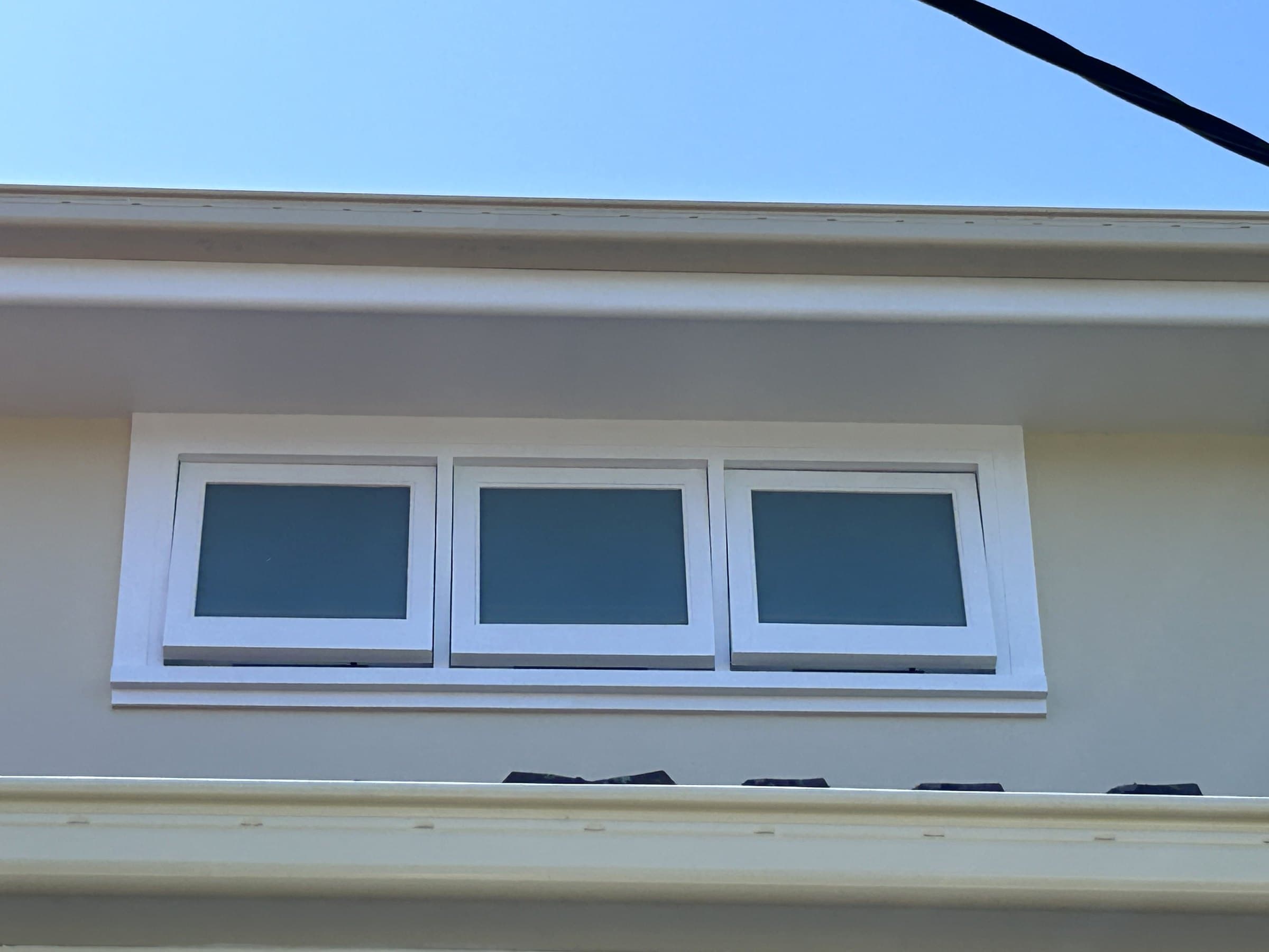 North Willoughby painted window trim and eaves detail