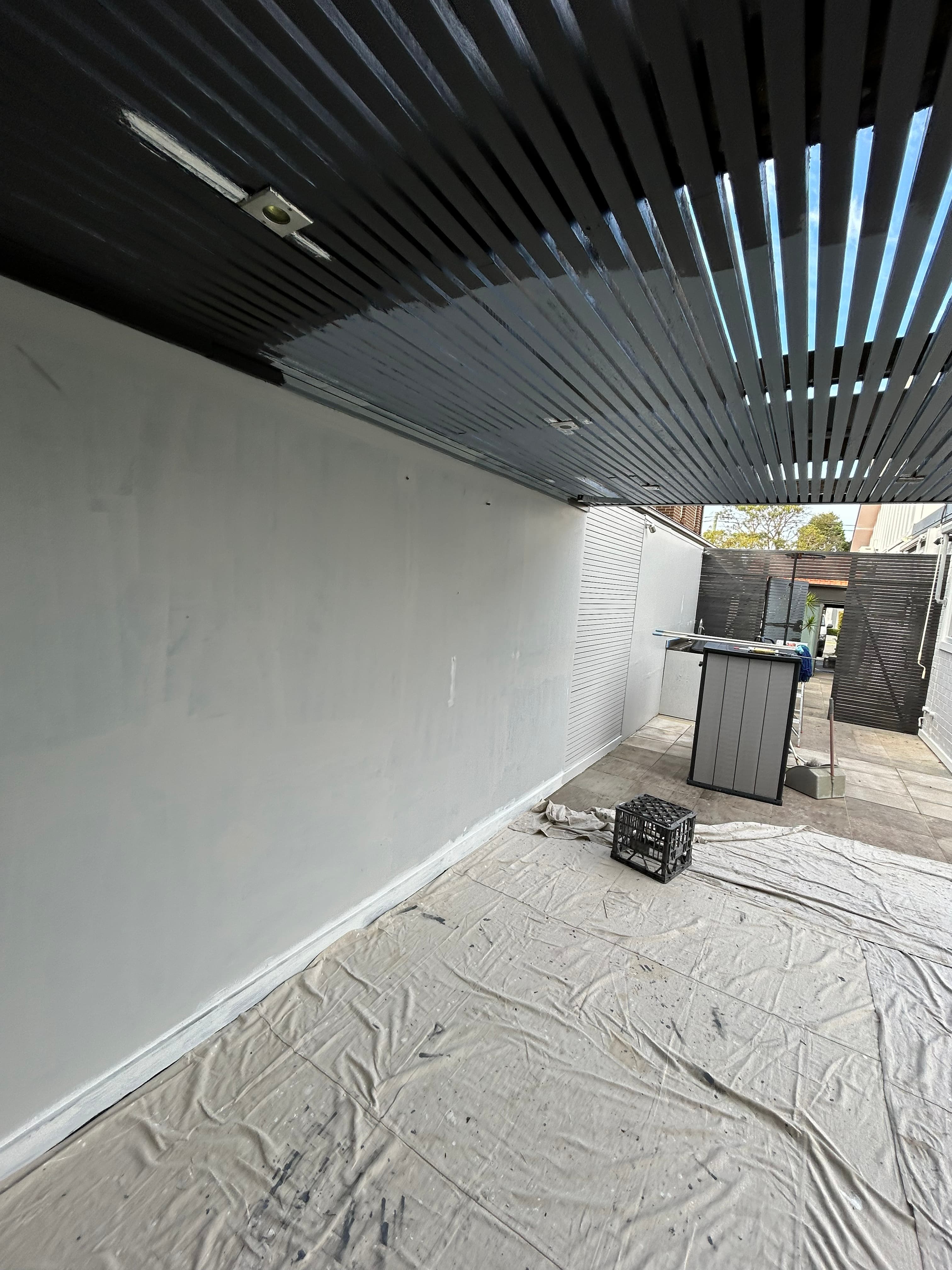 North Willoughby side wall protected and prepared during exterior painting