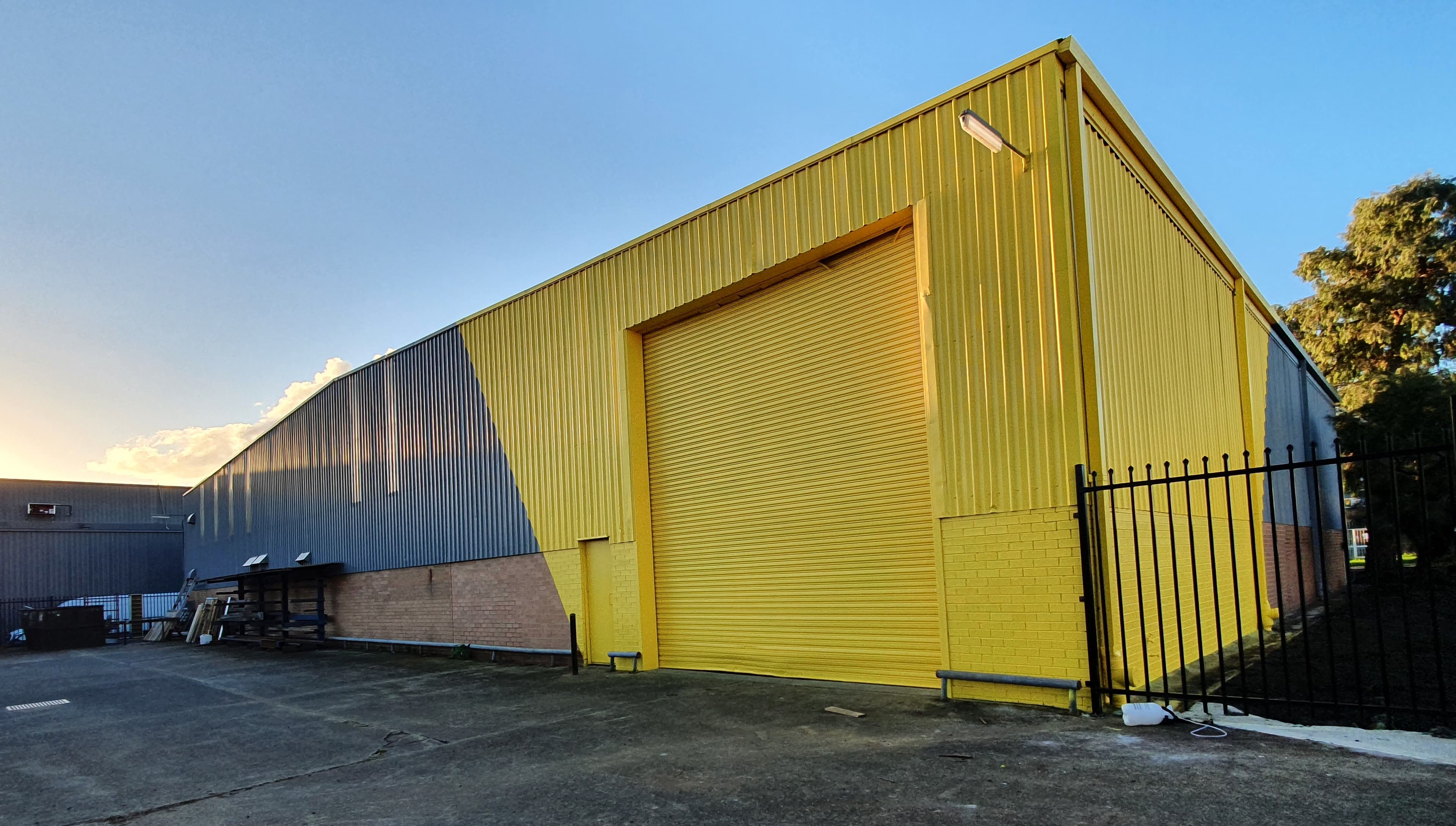 Silverwater commercial warehouse facade after yellow exterior repainting