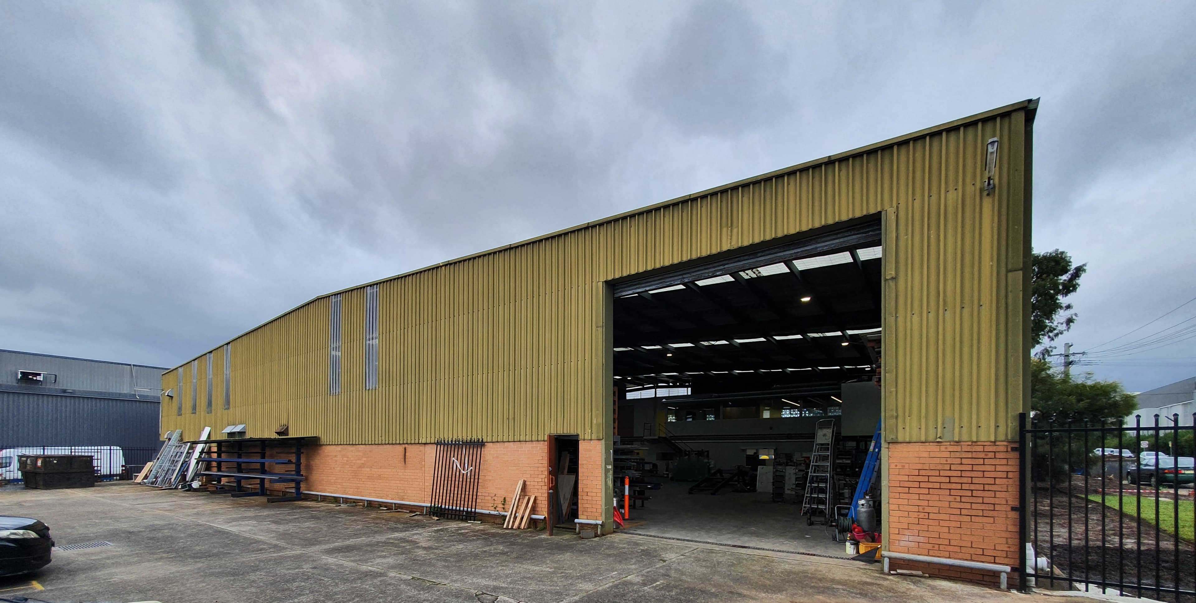 Silverwater commercial warehouse facade before exterior repainting