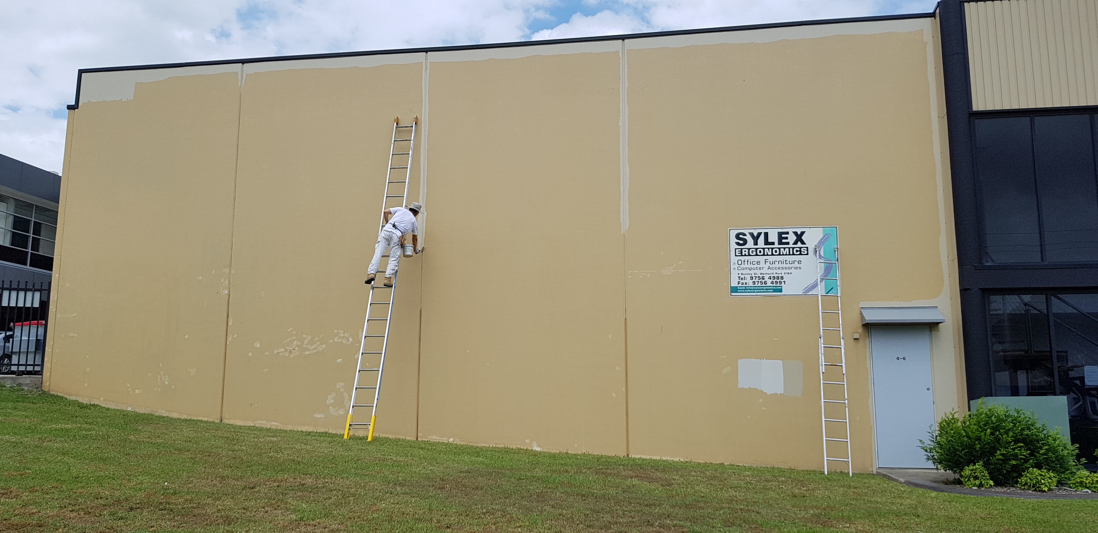 Wetherill Park commercial building facade before repainting with preparation underway