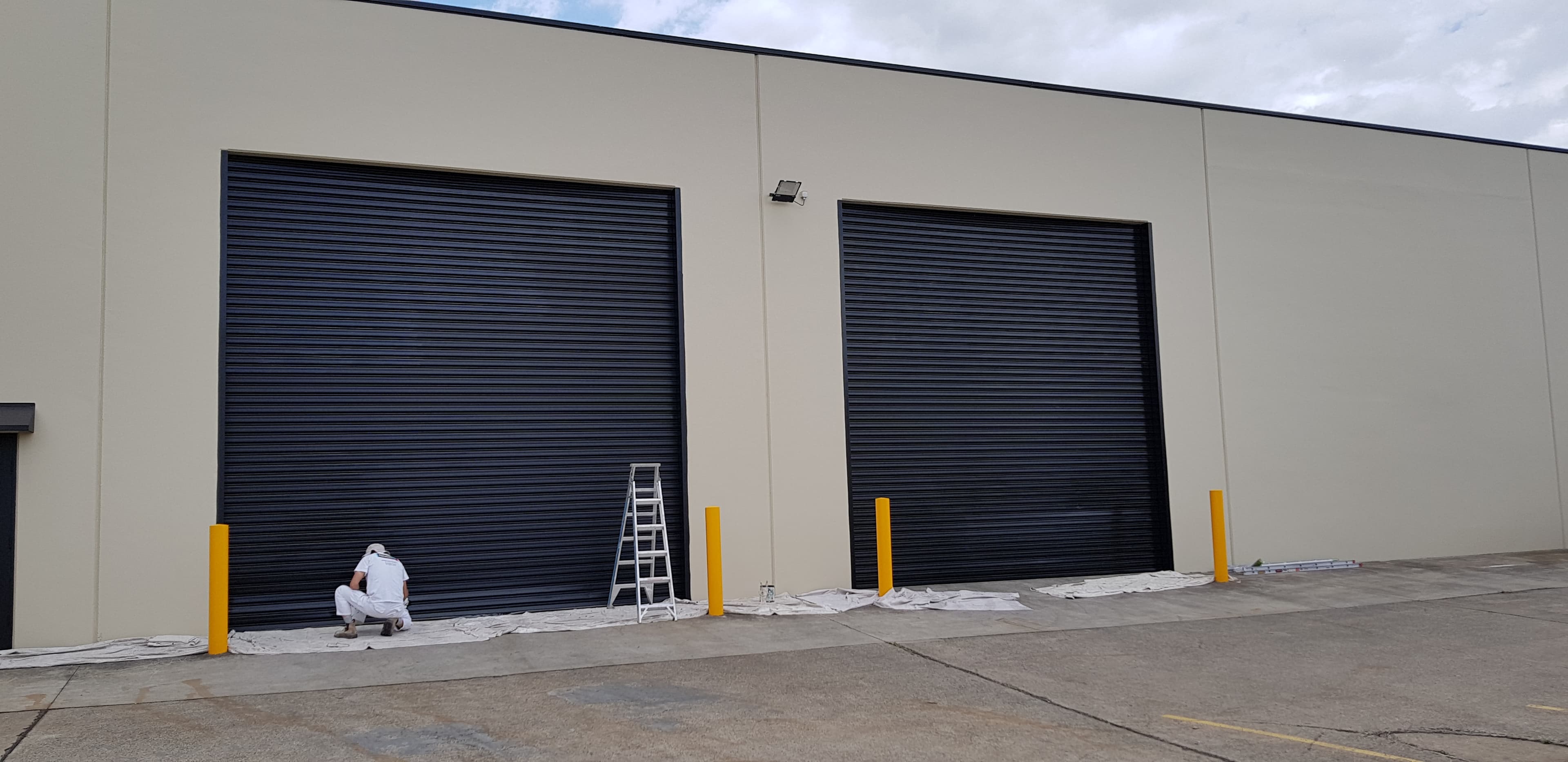 Wetherill Park commercial roller doors after dark exterior repainting
