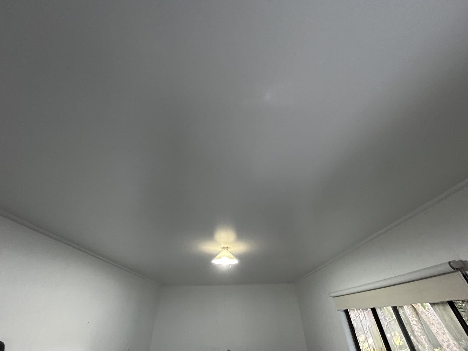 Willoughby ceiling after surface restoration and a clean repainting finish