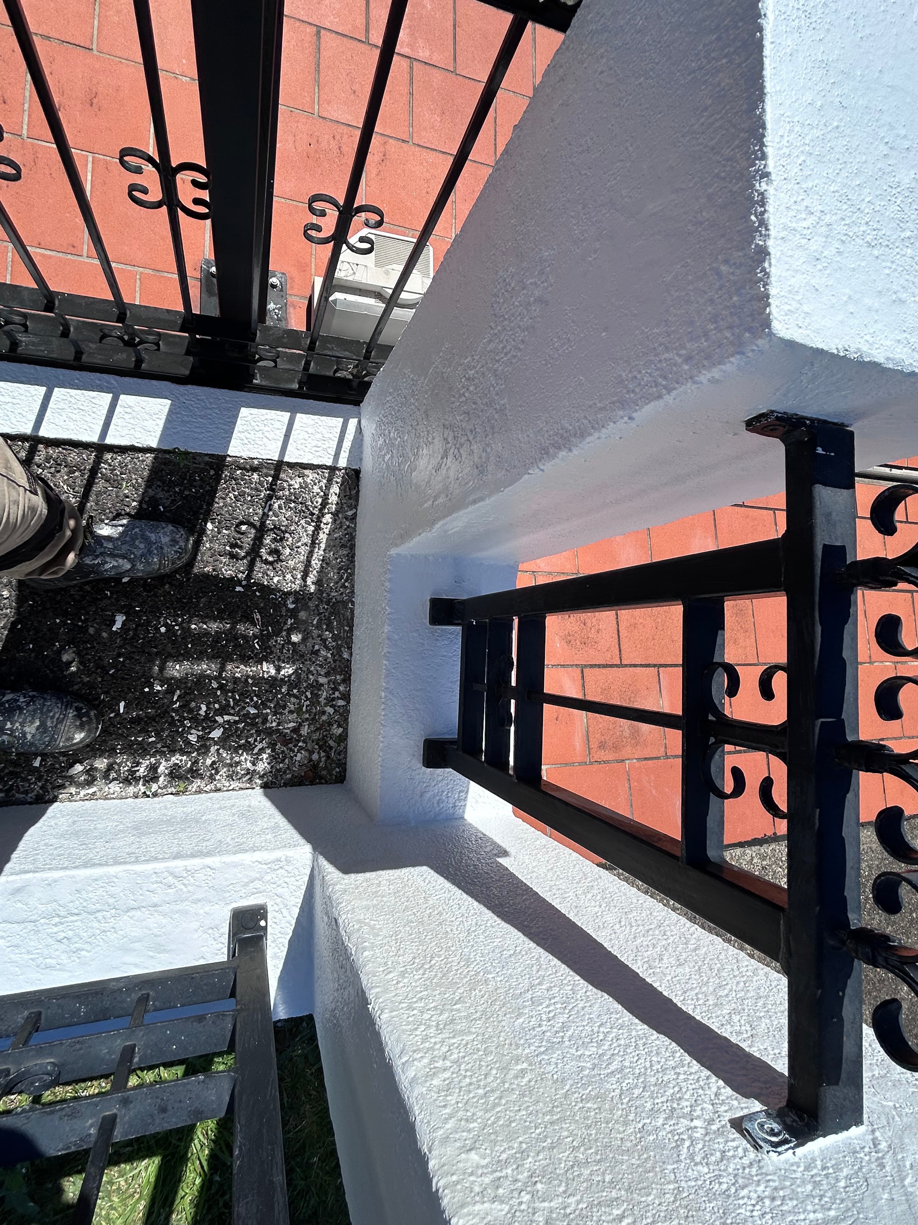 Blakehurst gate pillar and adjoining concrete fence after painting
