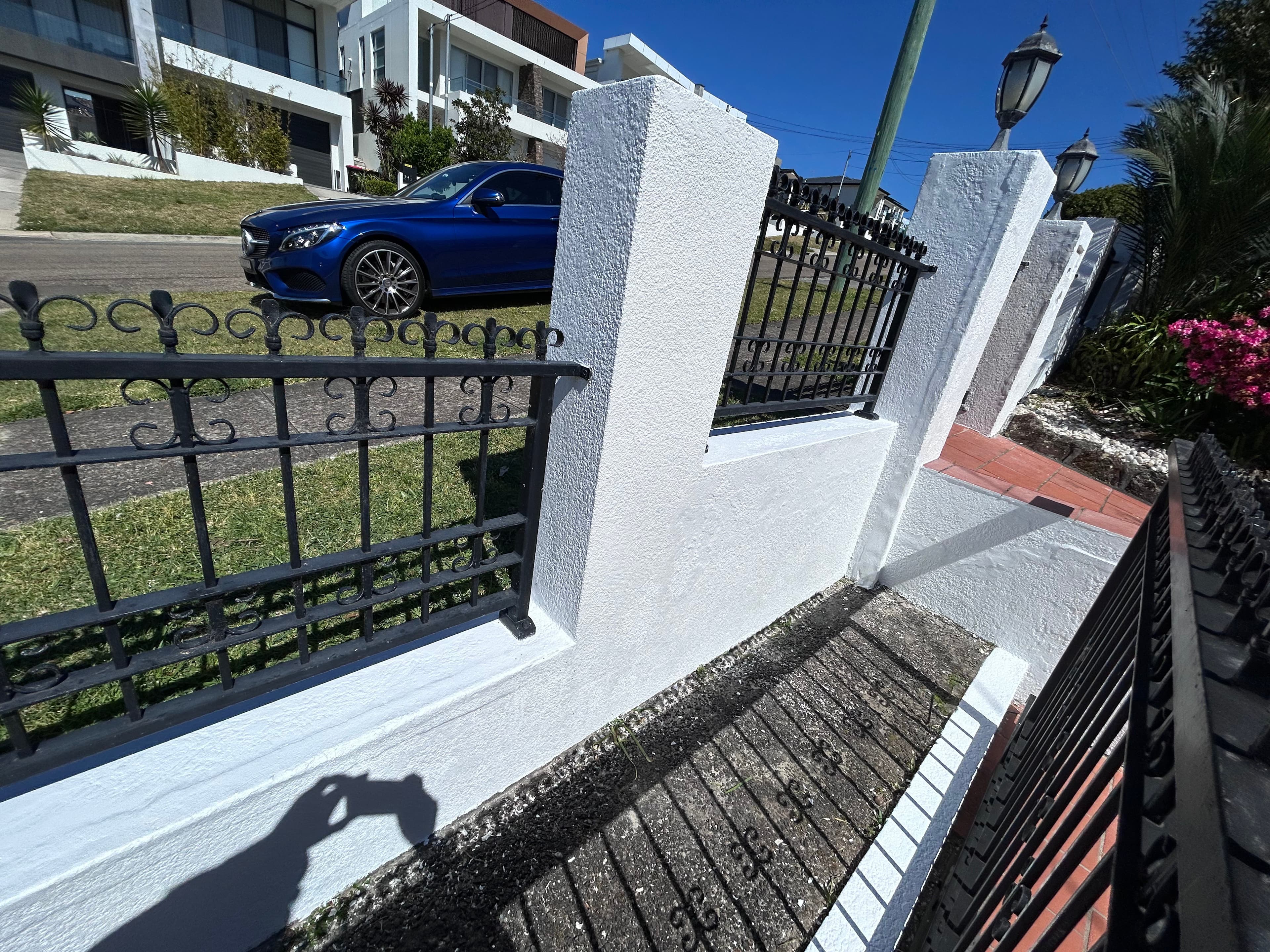 Blakehurst inner concrete fence after repainting from a wide angle