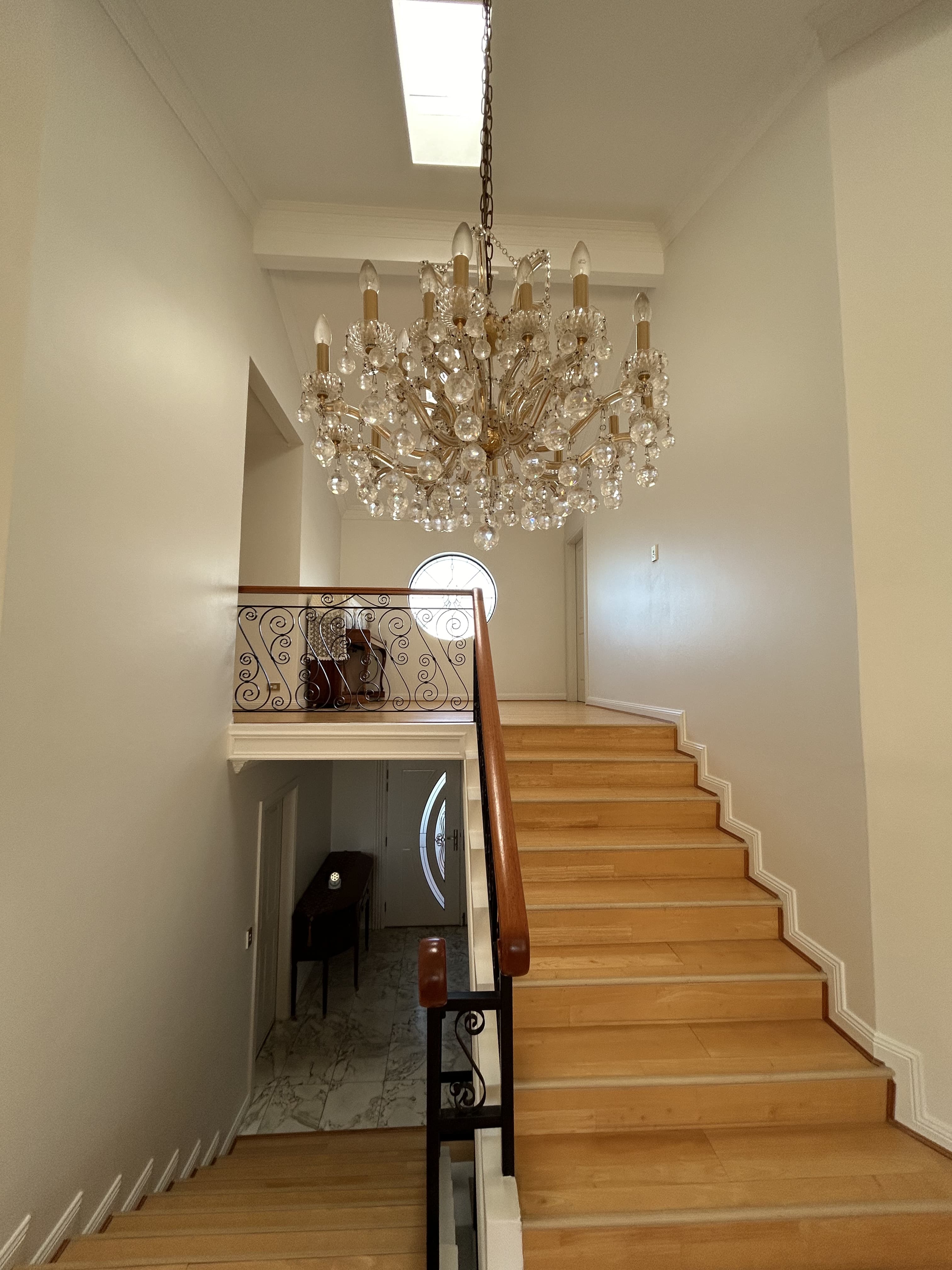 Blakehurst stairwell and chandelier after interior painting