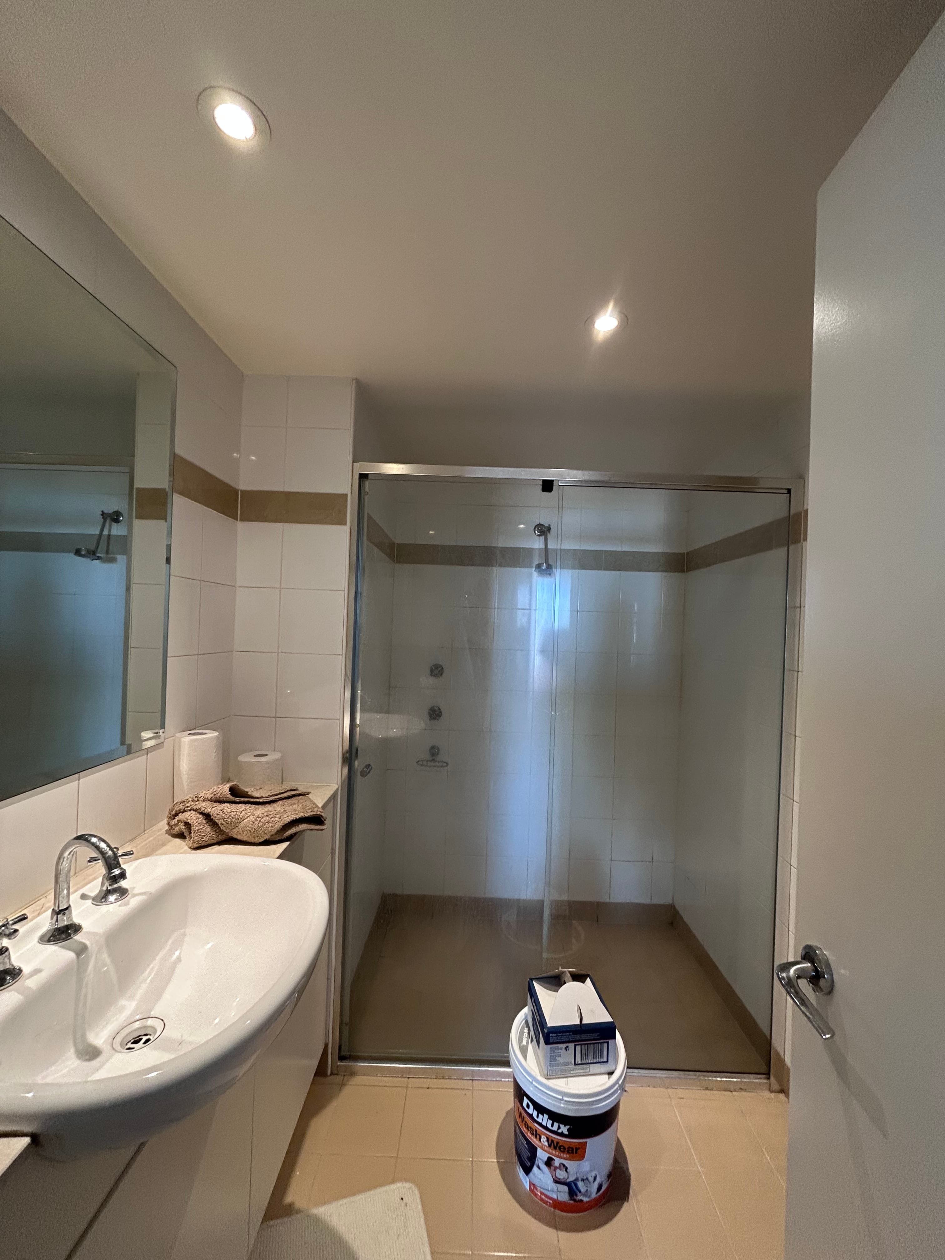 Chatswood apartment entry and kitchen-side walls after repainting