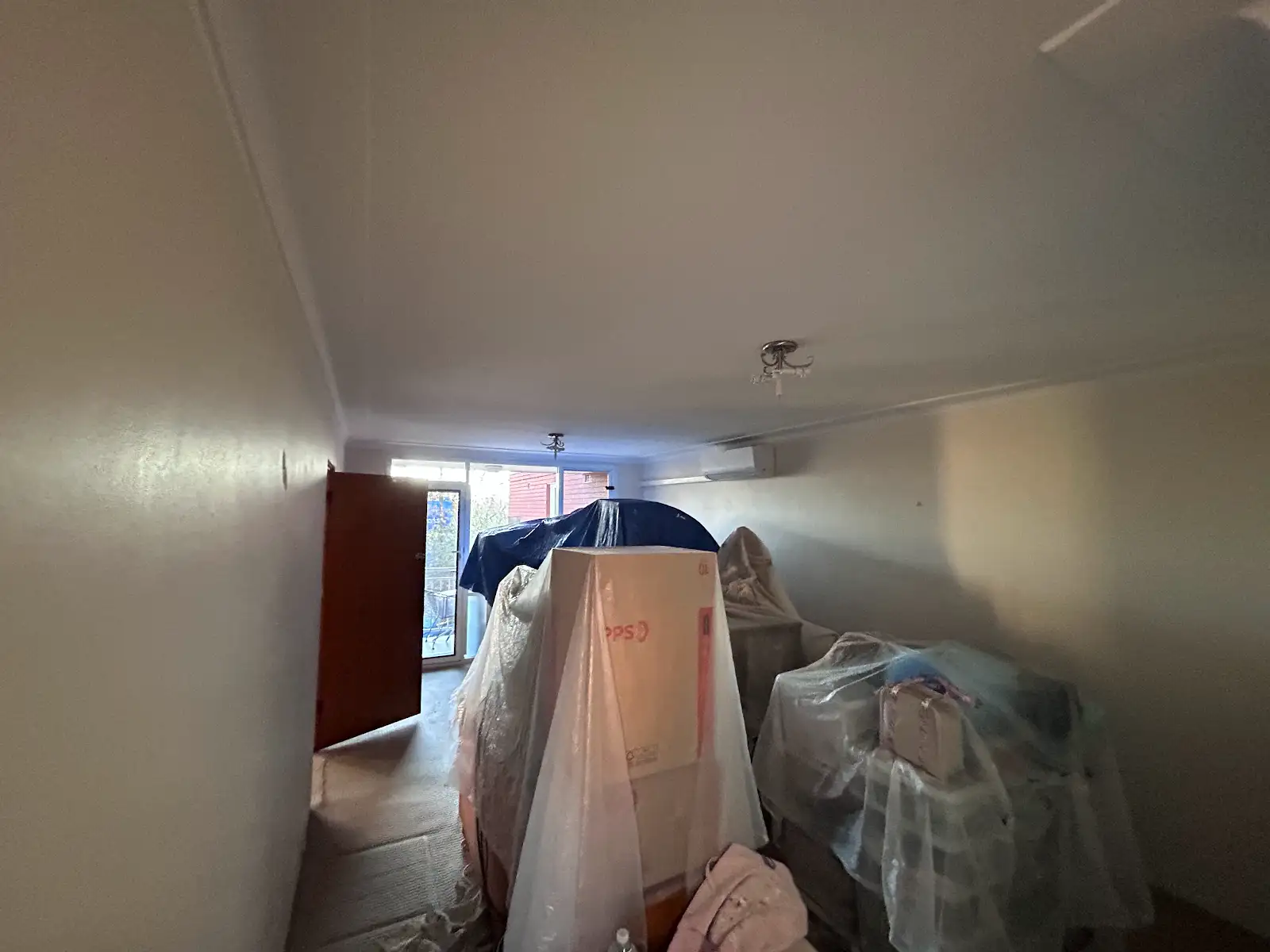 Chatswood apartment living room furniture protected during interior repainting
