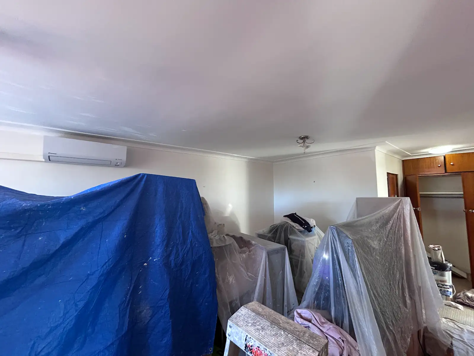 Chatswood apartment open-plan living area protected during interior painting