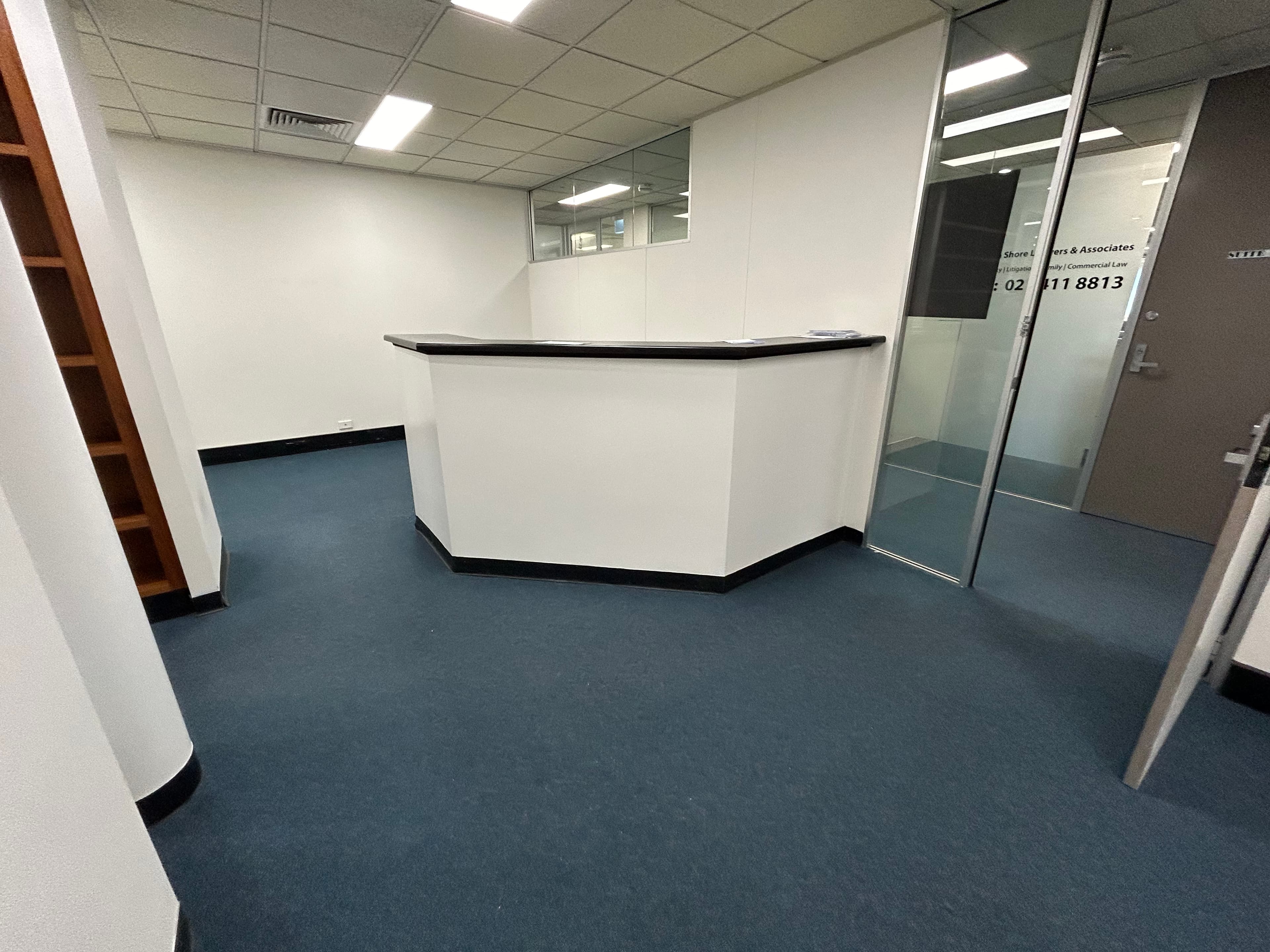 Wide view of Chatswood office reception and glass entry after commercial painting