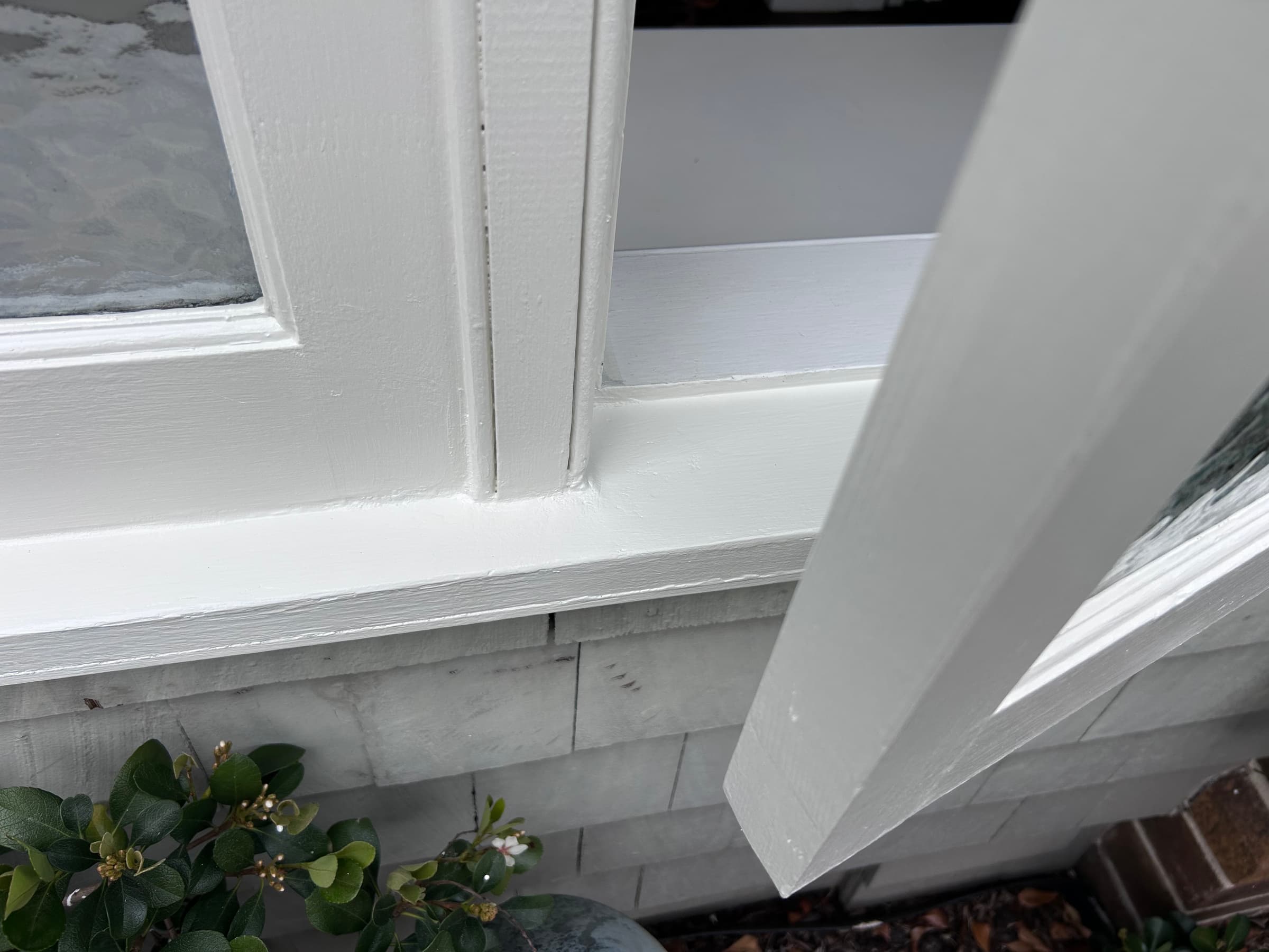 Chatswood timber window corner after localised repair preparation and white painting