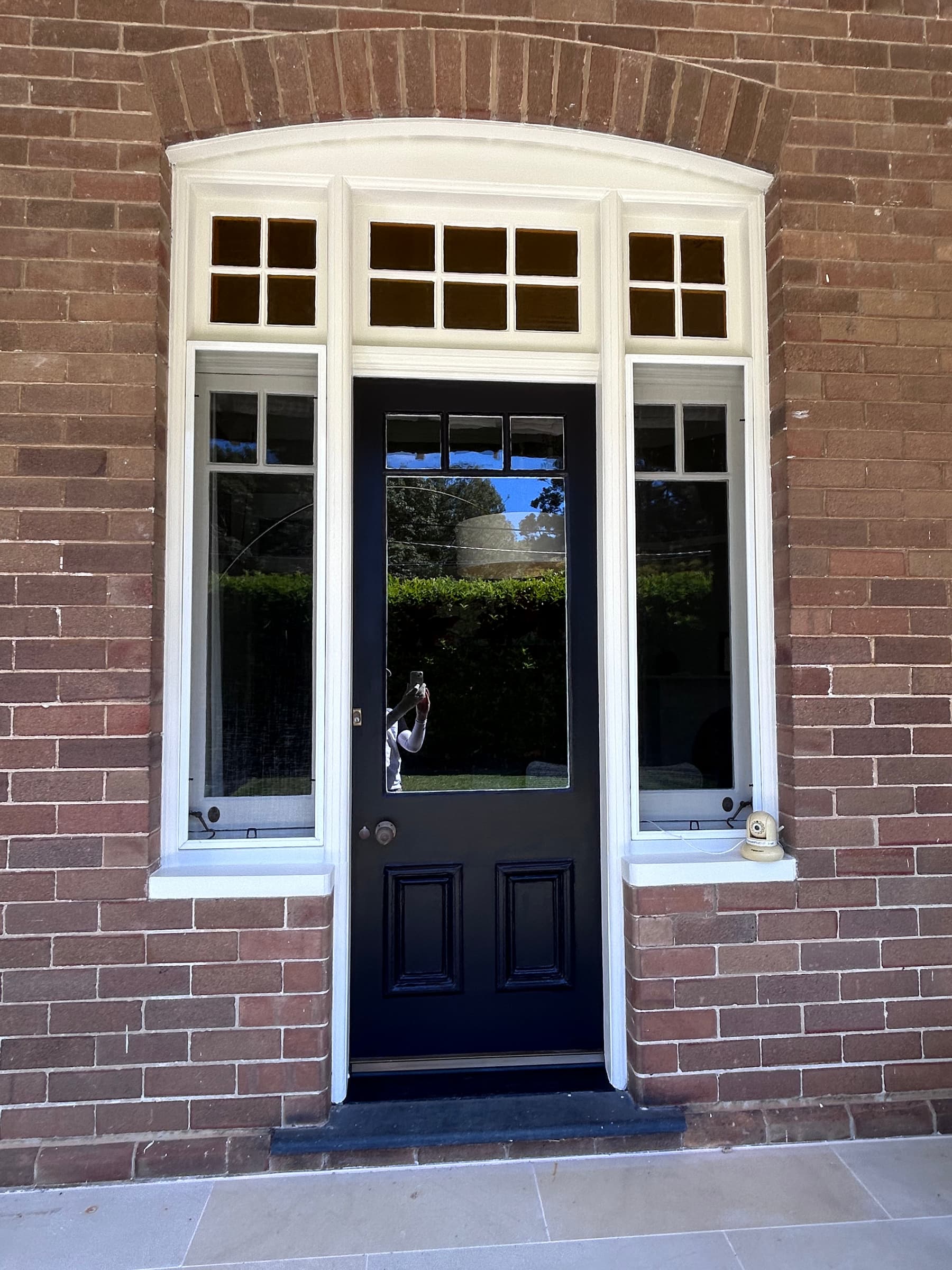 White timber window frames and joinery surrounding a Chatswood entry