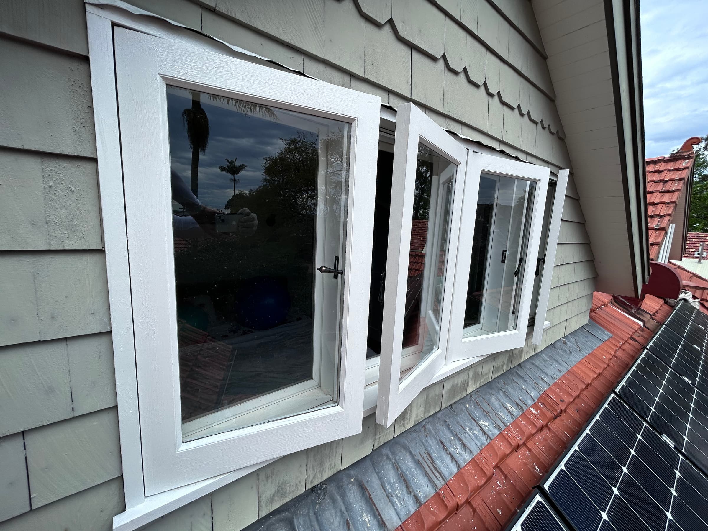 Upper-level outward-opening timber windows after painting in Chatswood