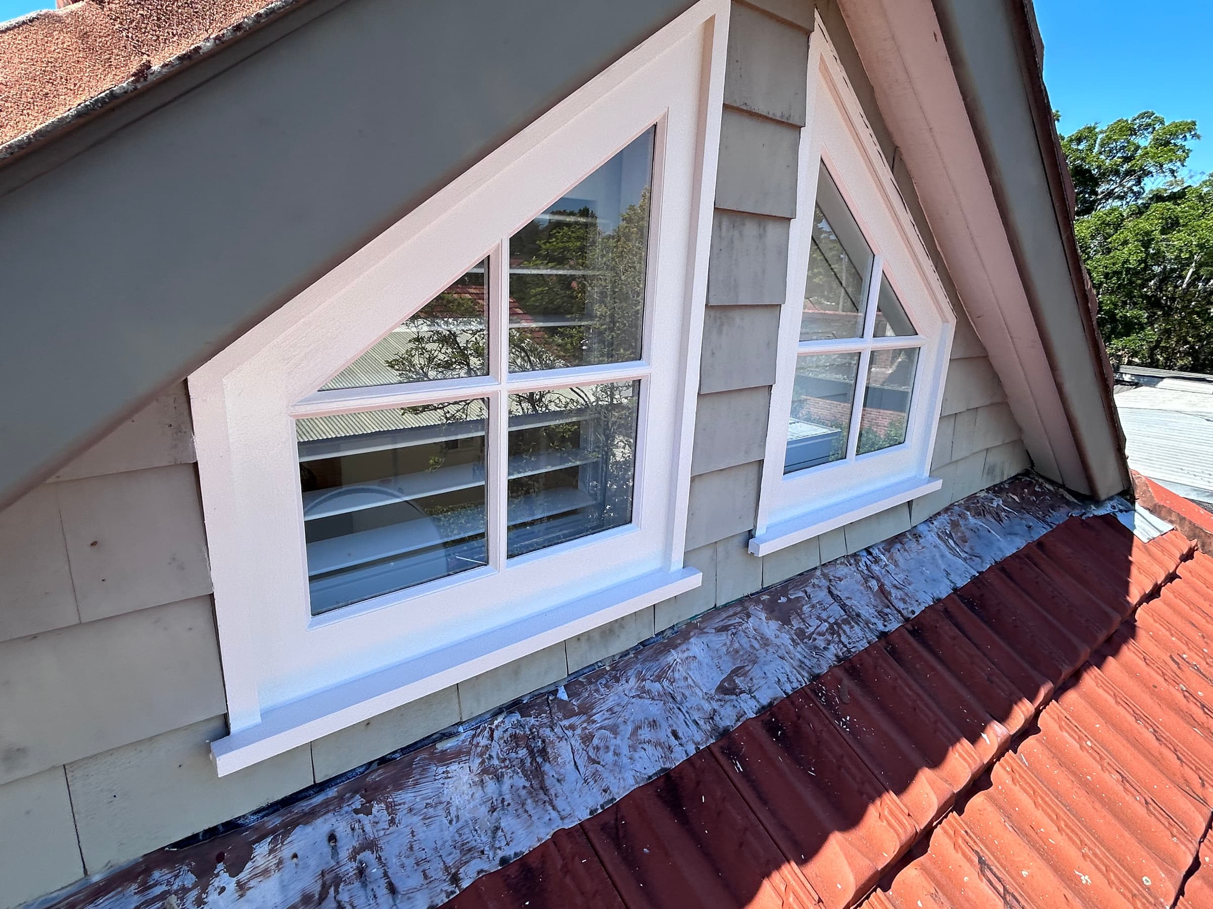 Two Chatswood gable windows with completed white timber painting