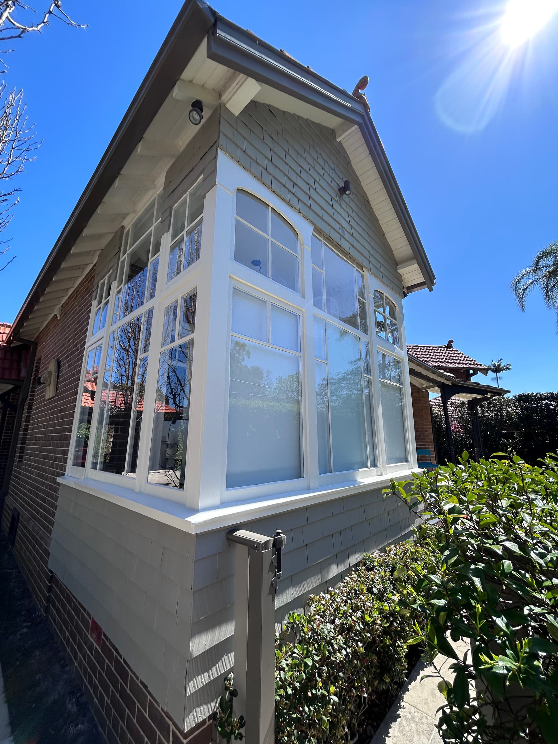 Chatswood bay window exterior with completed white timber frame painting