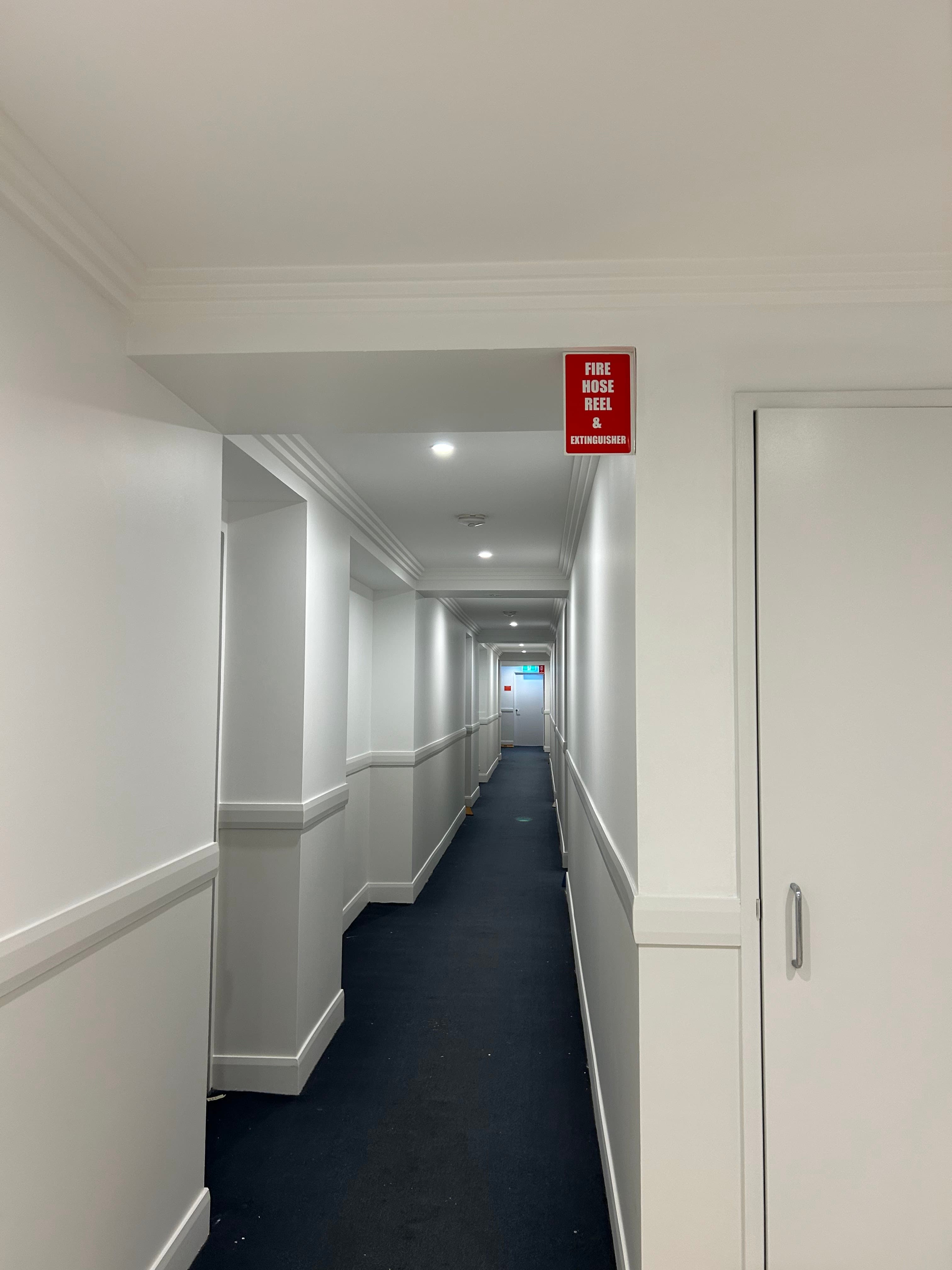 Dee Why strata corridor after repainting with clean walls, trims, and ceiling
