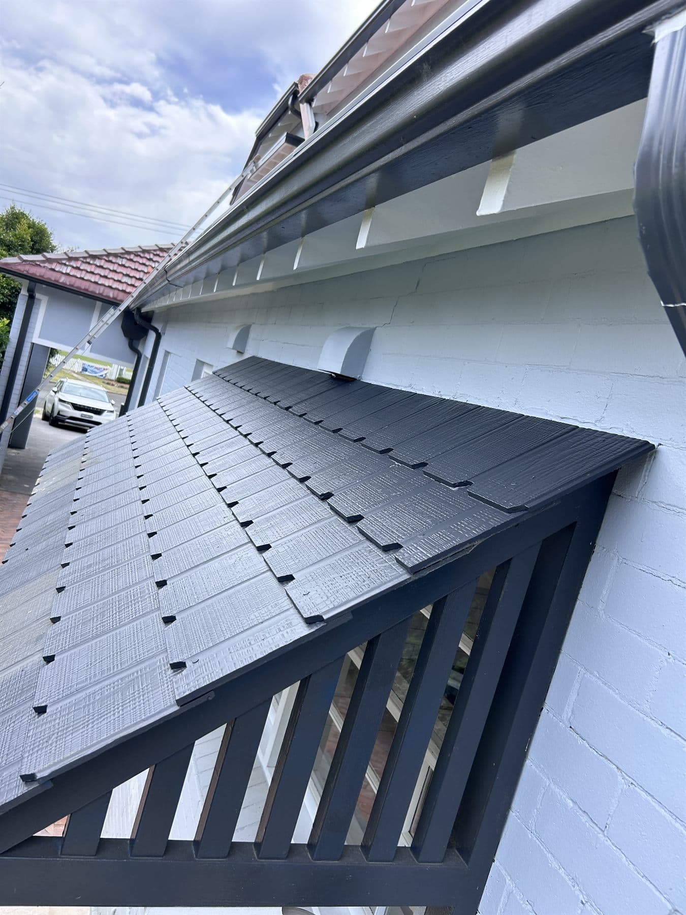 East Lindfield awning roof, gutter, fascia, and wall trim after repainting