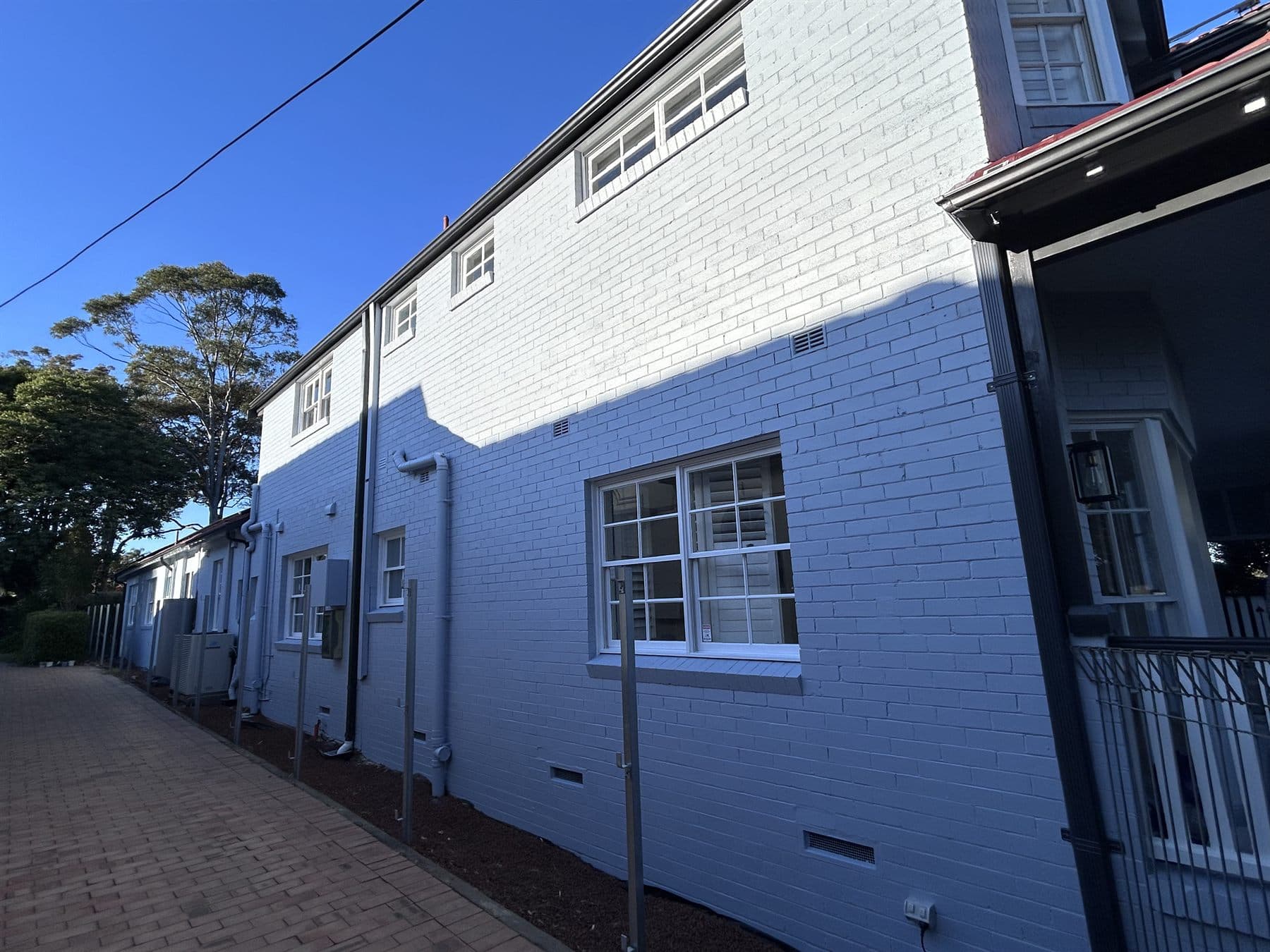 East Lindfield side wall and window trim after exterior repainting