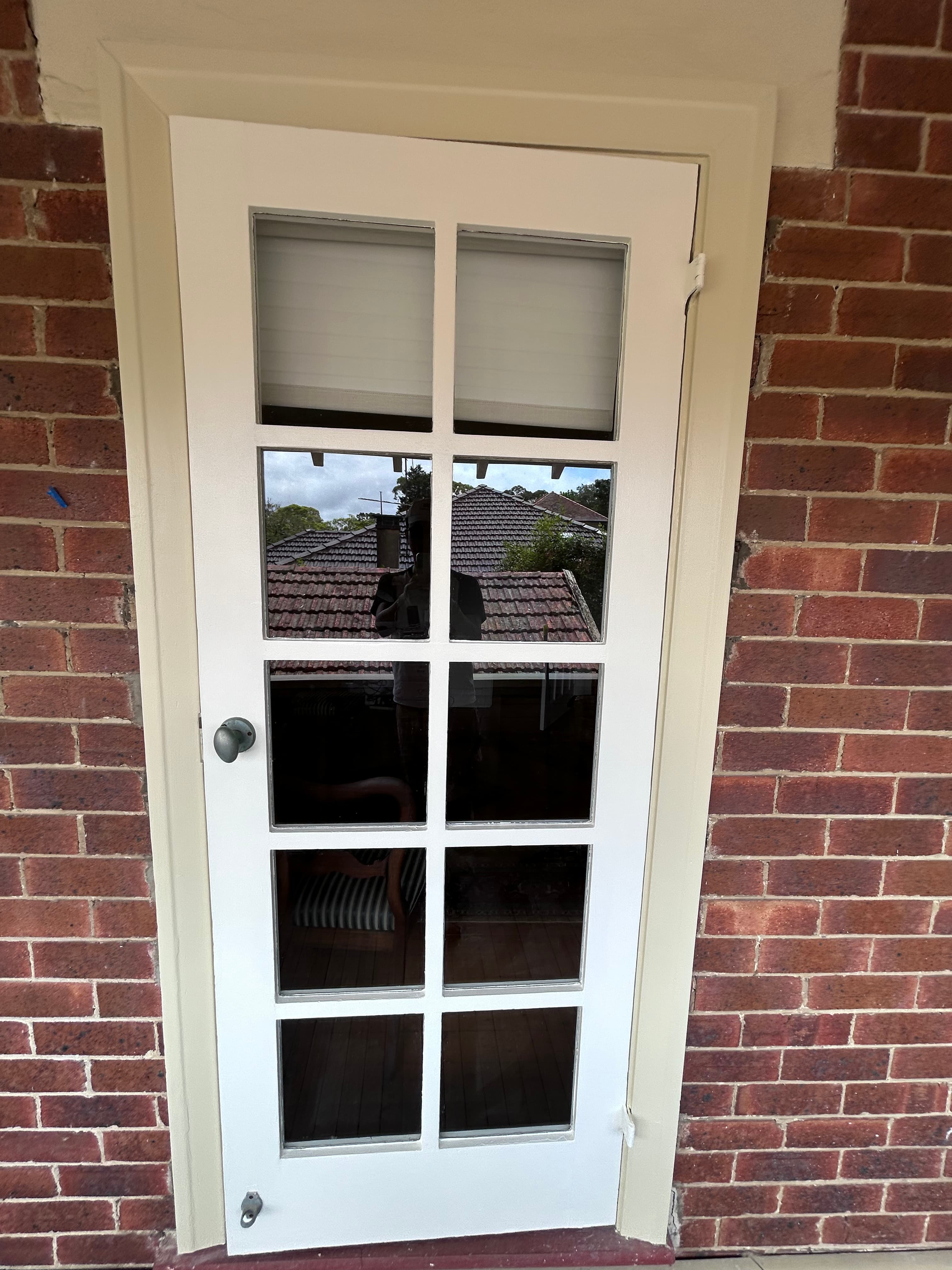 Lindfield exterior door and surrounding trim after repainting