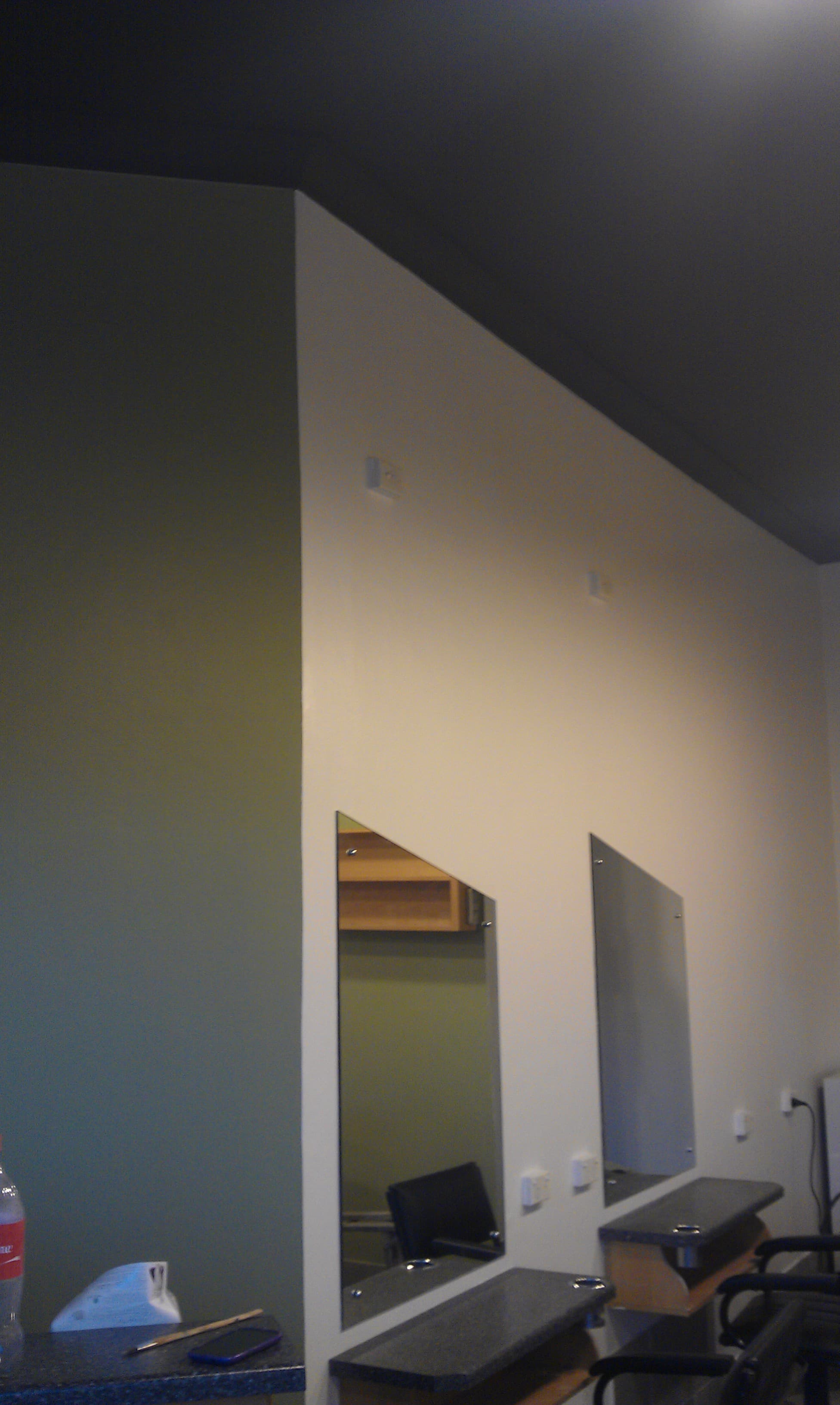 Marrickville salon feature wall, mirrors, and dark ceiling after repainting
