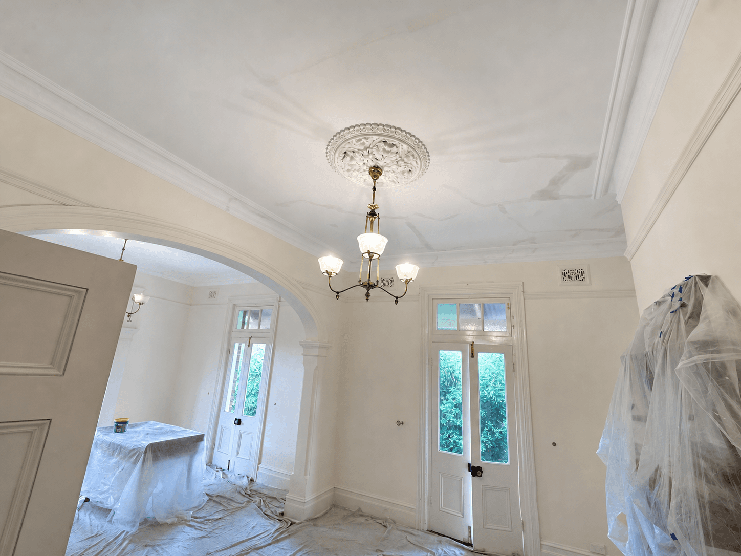 Mona Vale heritage room during ceiling preparation and furniture protection