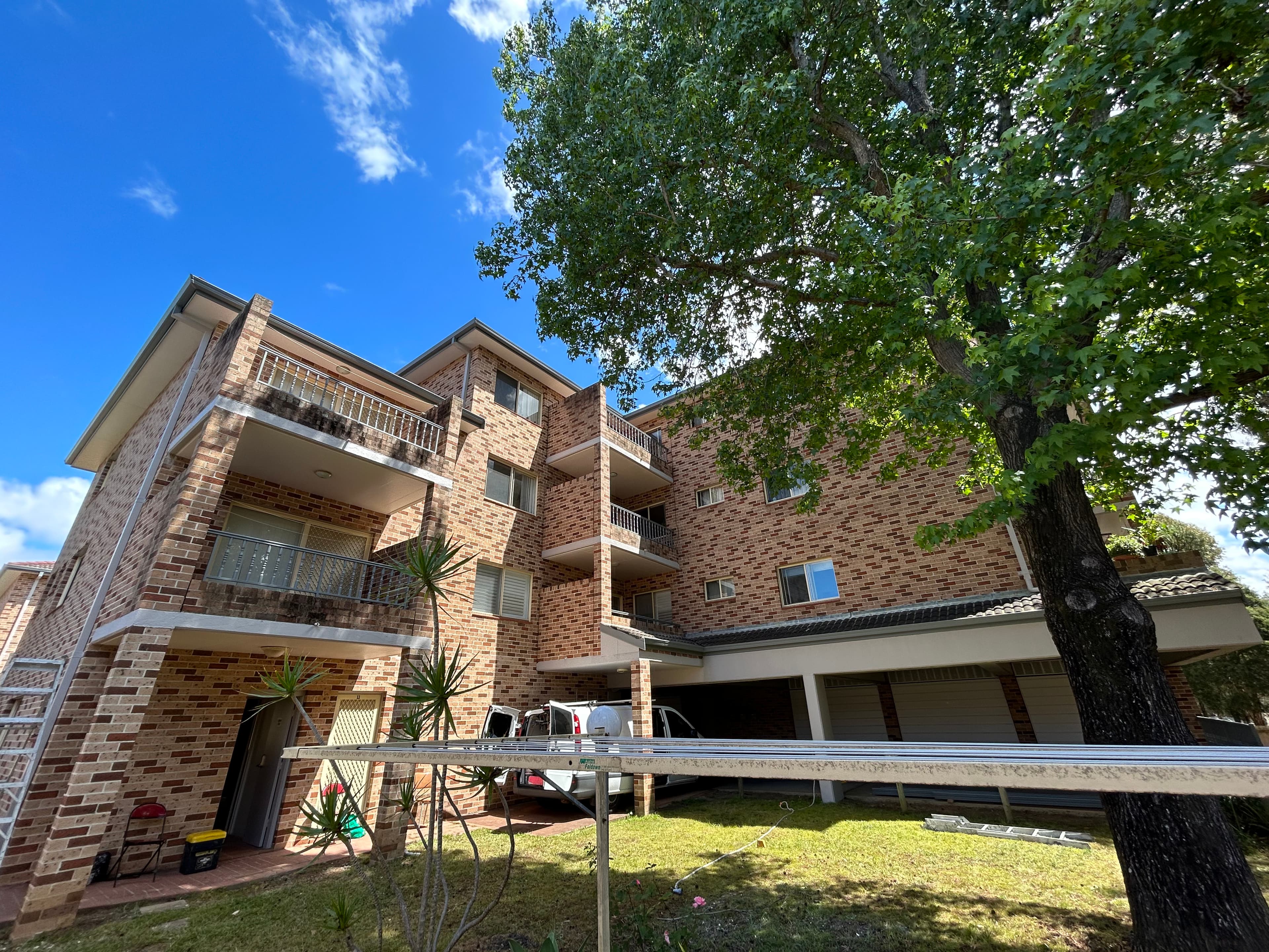 Narwee strata elevation beside tree line after painting refresh