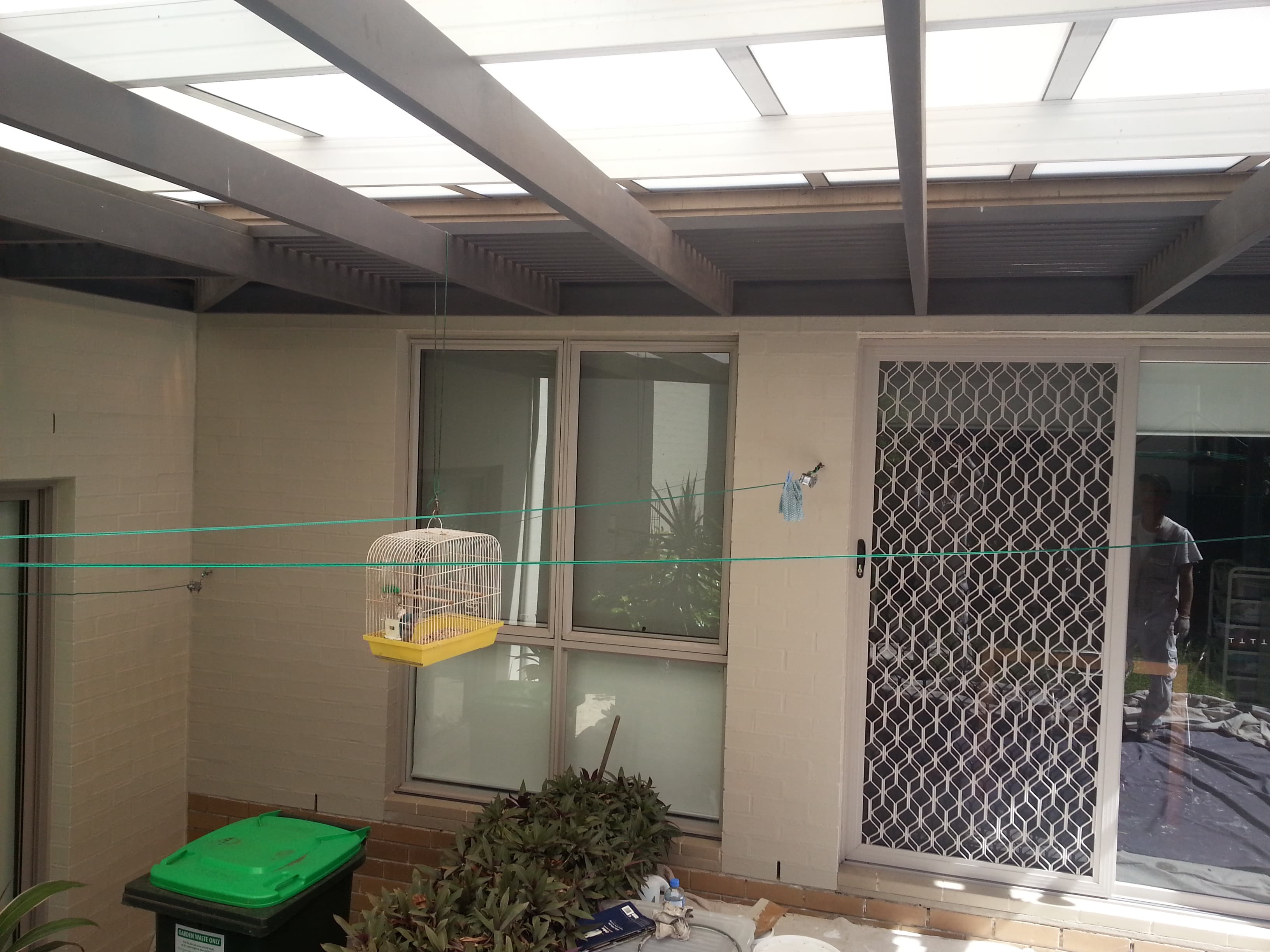 Newington patio wall and rear door area after exterior repainting