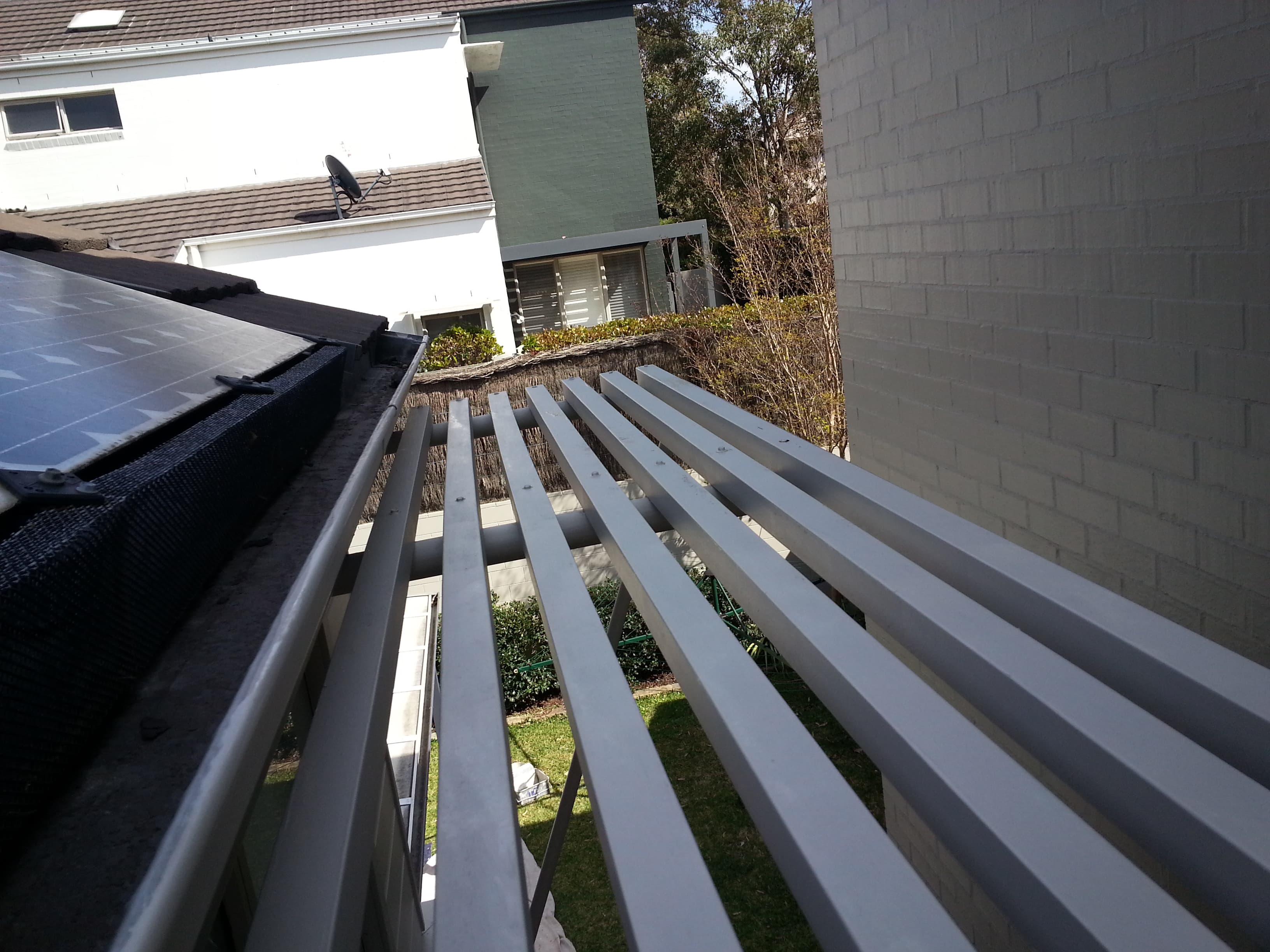 Newington upper pergola and exterior wall after repainting