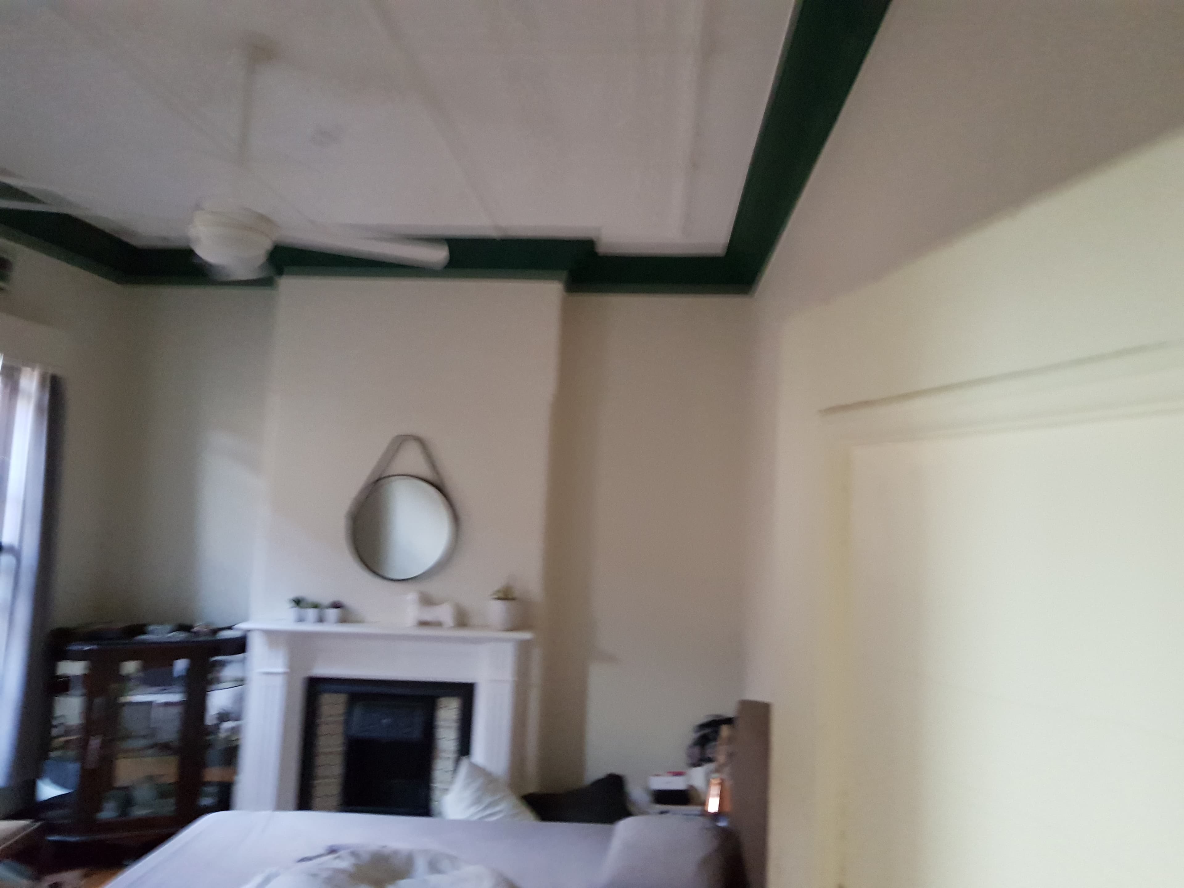 North Bridge bedroom fireplace and ceiling detail before interior repainting