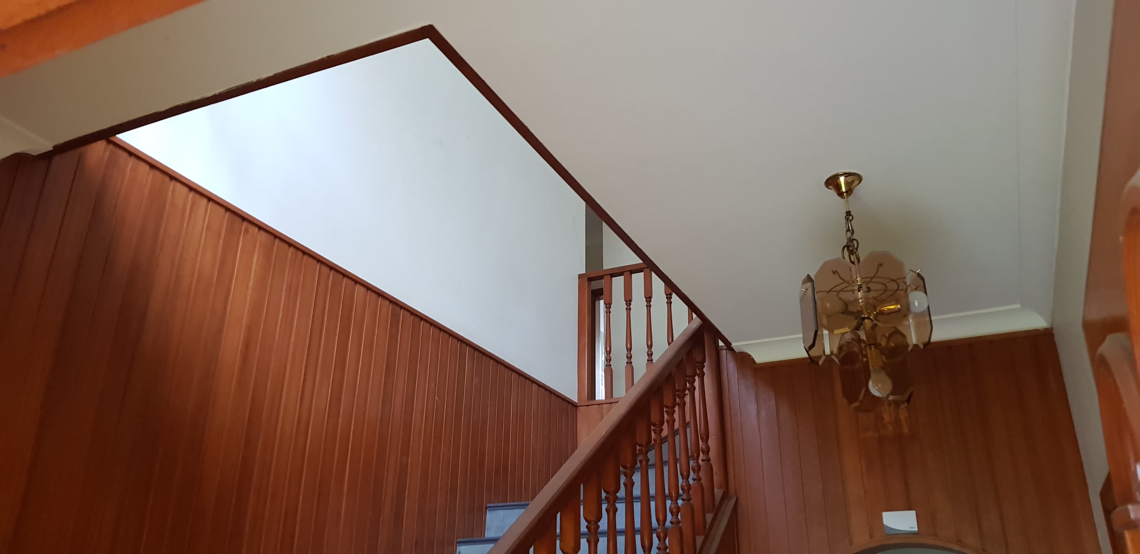North Ryde stairwell before repainting with timber wall lining