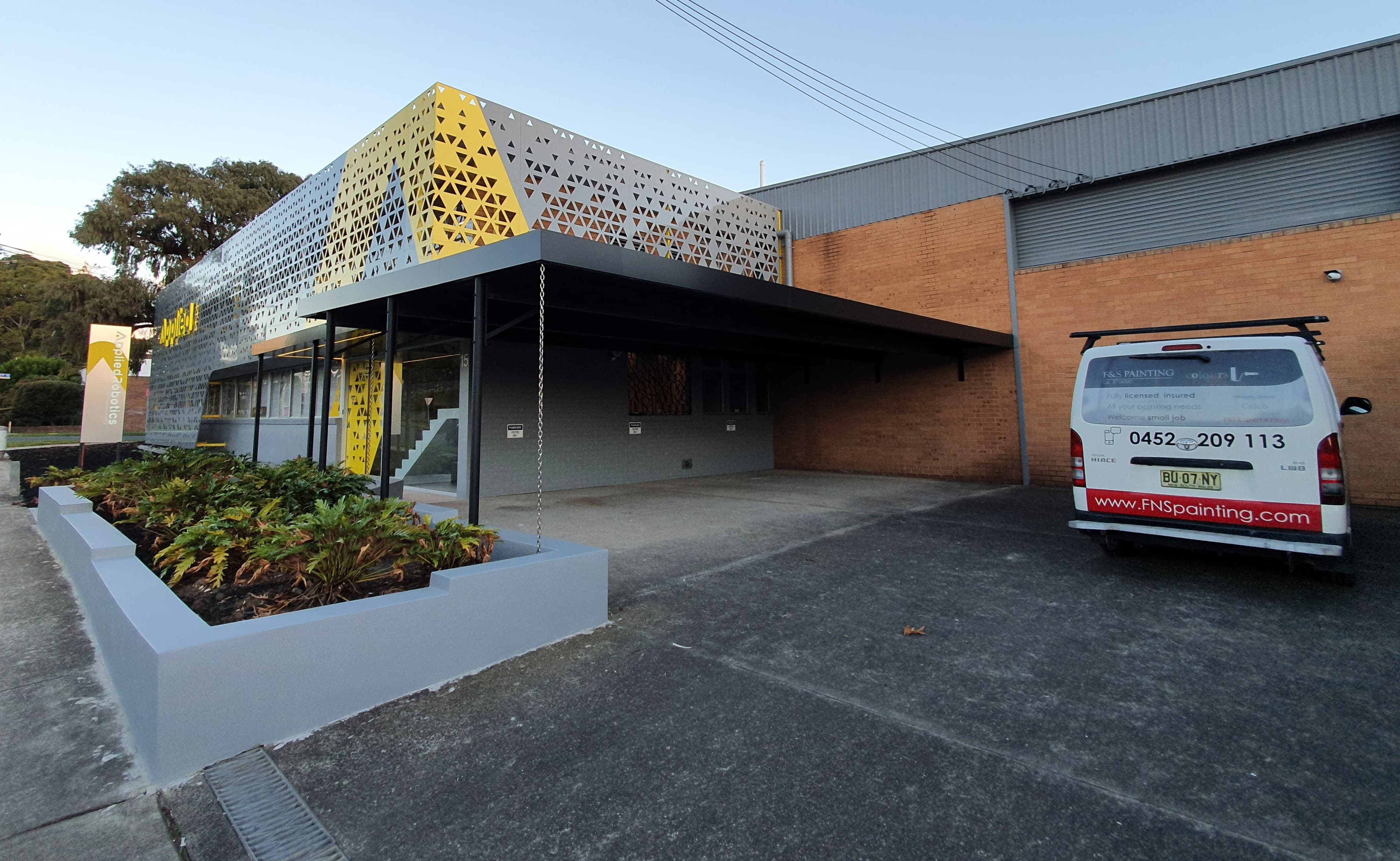 Silverwater commercial entry after exterior painting with F&S Painting van