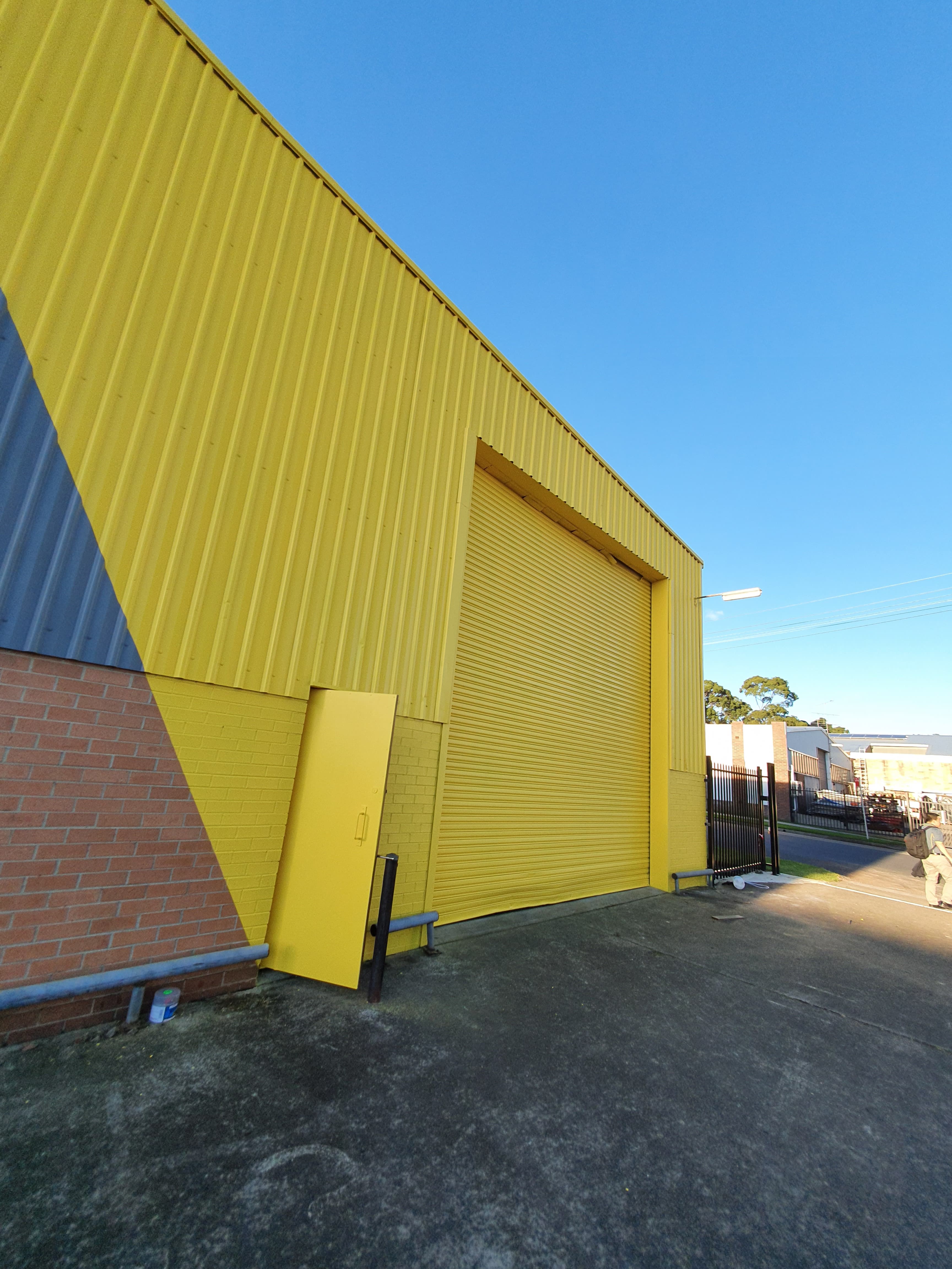 Silverwater commercial rear facade after yellow exterior painting